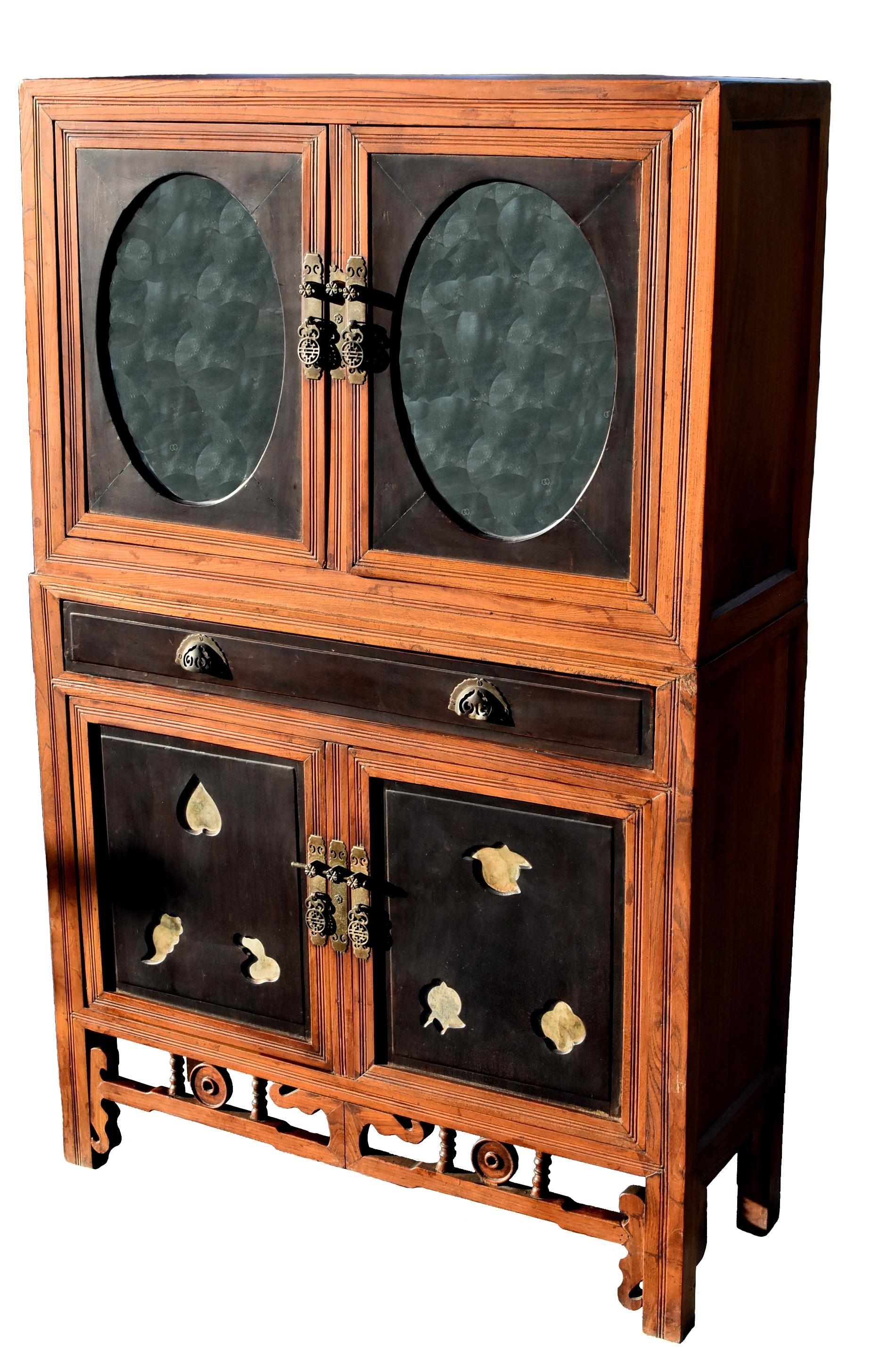 A highly sophisticated scholar's cabinet from turn of the century. Solid wood throughout, mitered, tenon and mortise construction. Contrast of dark rosewood and natural color elm wood with beautiful grains. Elegant mirrored top chest. Doors of