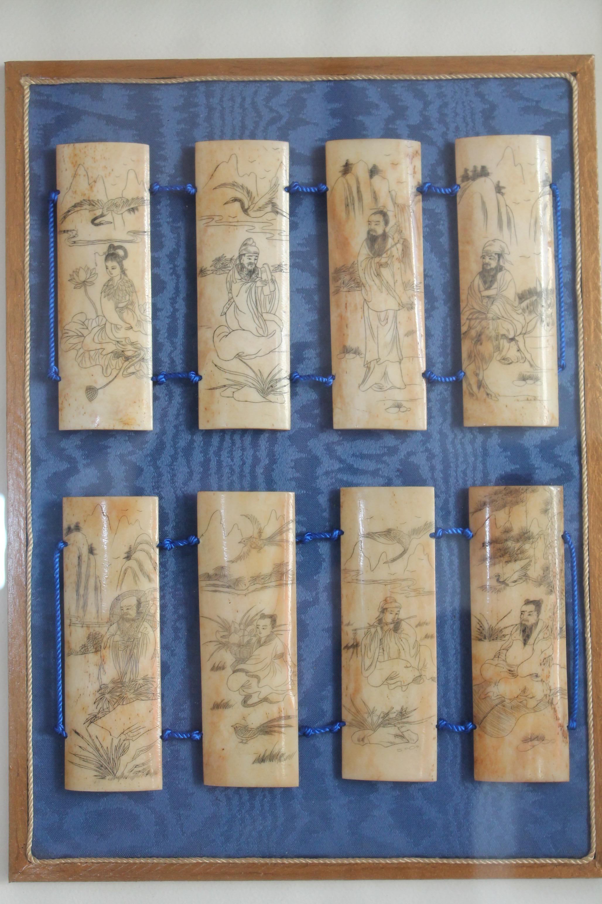 Antique Scrimshaw bone etched/carved panels from the 19th century.
It is richly adorned with flowers (lotus and more), birds, mountain scenes, and empire figurines in a great box framing presentation in Radica.

Measures: 10x4cm (4x1.75in.) each