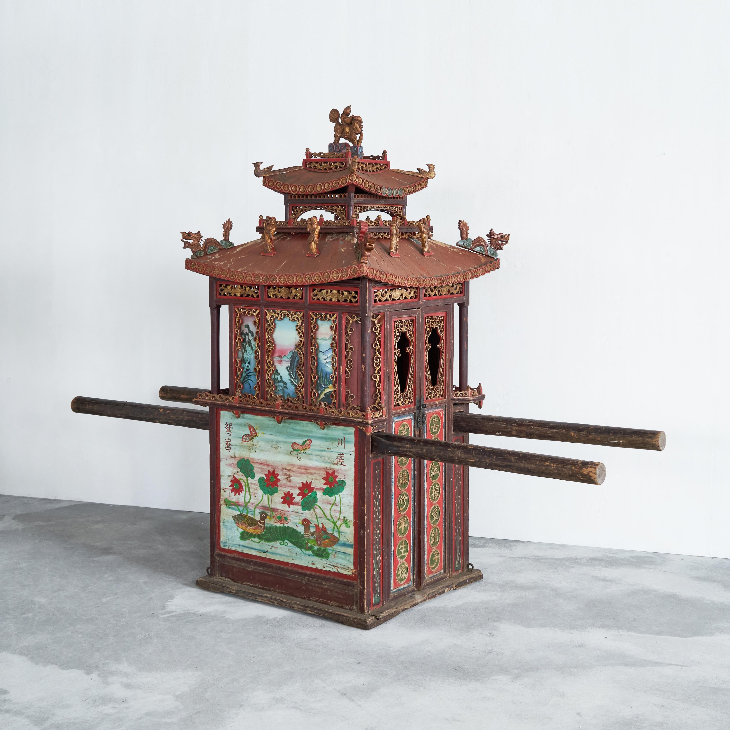 Antique Chinese sedan chair, China, late 19th century. 

This colorful and extraordinary decorated antique sedan or wedding chair from China is really something else. The origins or the Chinese sedan chair go back more than 4000 years. Used to