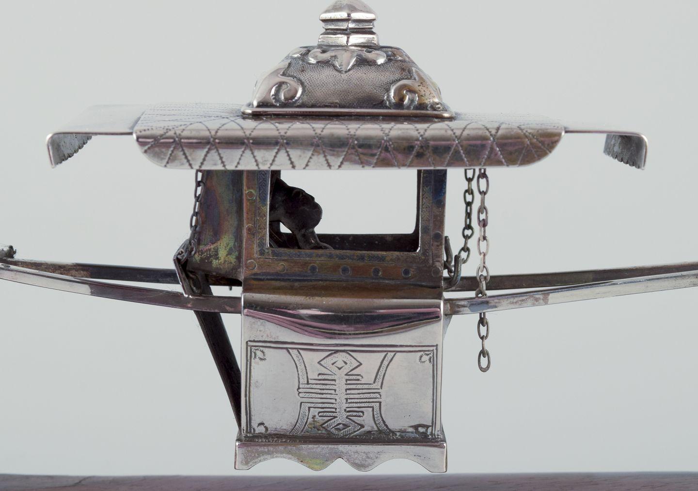 Pre-owned goods are exempt from import duties for U.S. customers. 
Therefore, no import tariffs will be applicable to your purchase.

Antique Chinese Sedan Chair Carriage Sterling Silver.
Very good condition. The only damage is the corner of the