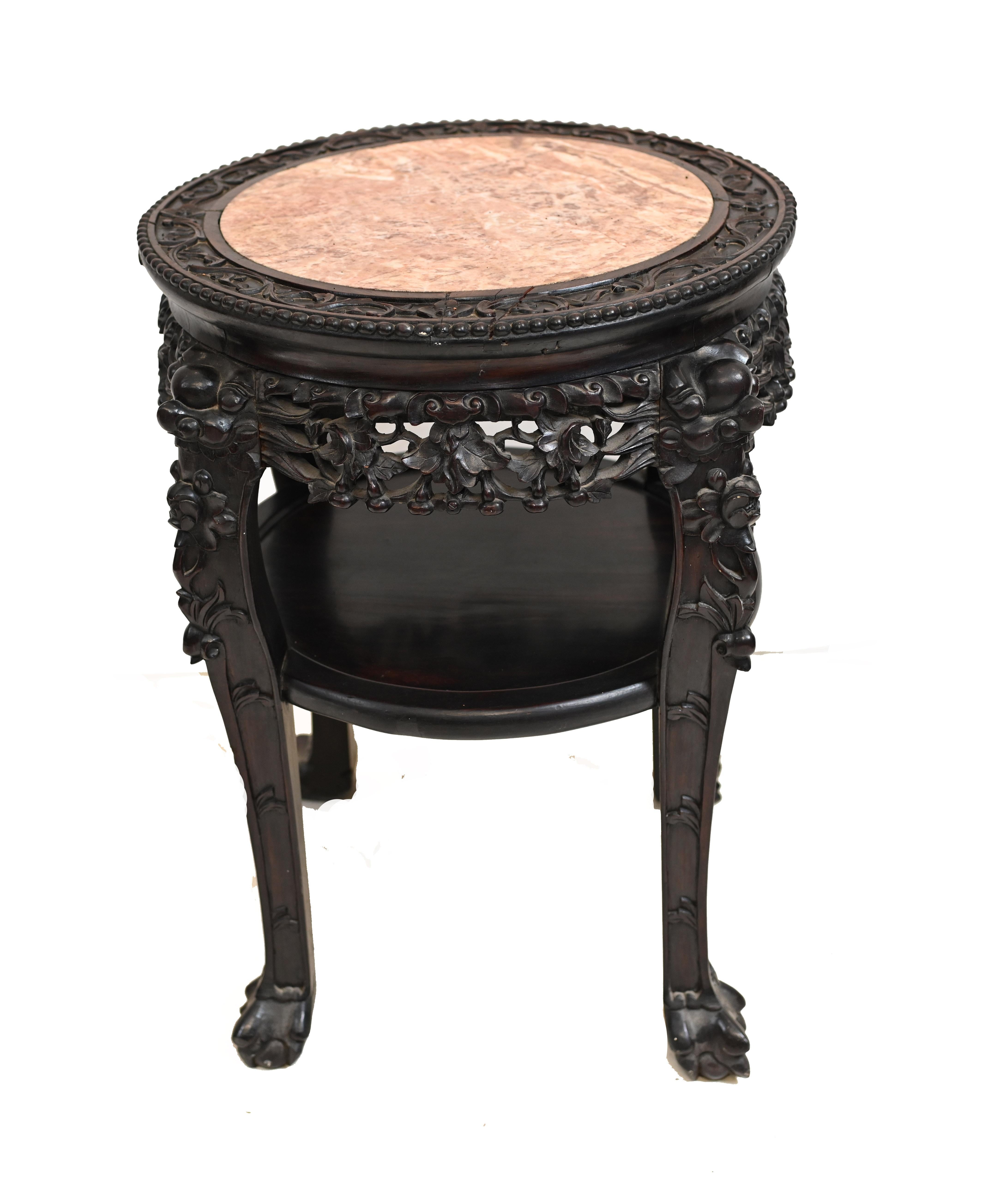 Gorgeous antique Chinese hardwood side table
Circa 1860 with round marble top 
Great designs to intricately carved base
Offered in great shape ready for home use right away
We ship to every corner of the planet.

   