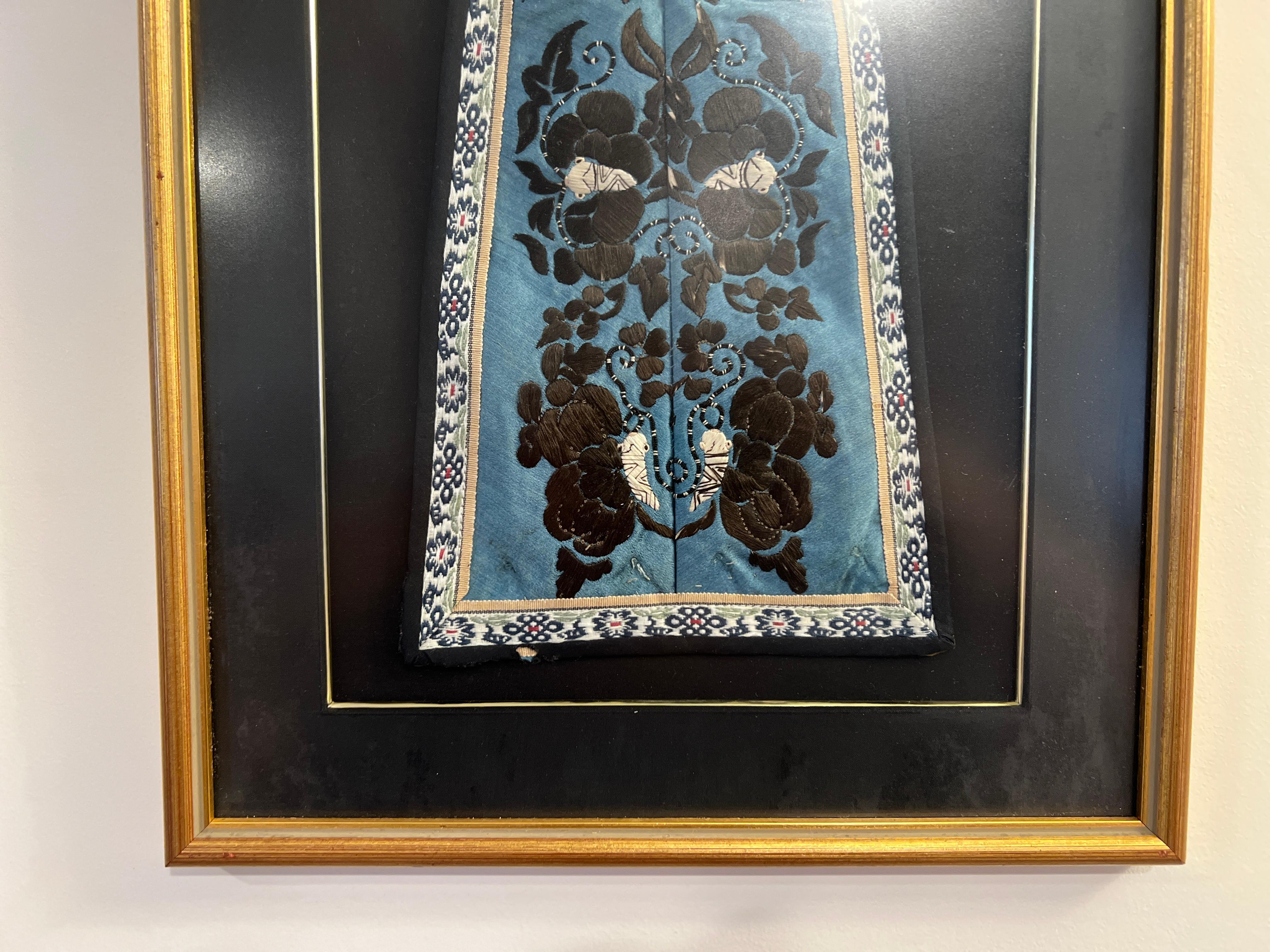 Chinese Qing Dynasty (1644-1911), 19th century. 

Step into the lavish world of the Qing Dynasty with this exquisite antique Chinese silk embroidery Manchurian robe panel. Embellished with a graceful butterfly motif, this panel reflects the elegance