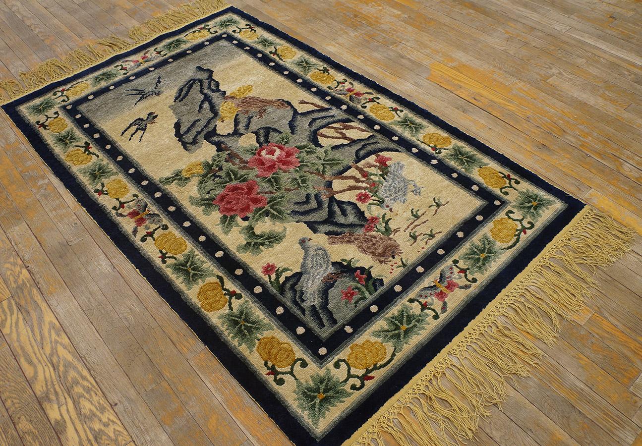 Antique Chinese silk rug measures: 3' 2'' x 5' 2''.
