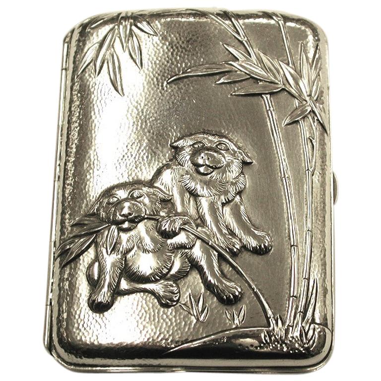 Antique Chinese silver cigarette case depicting red pandas with bamboo, circa 1910
Detailed die cast relief work with very fine hand-hammered texture, with a sprung hinge.
No Chinese hallmarks but the quality is typical of Chinese silver.