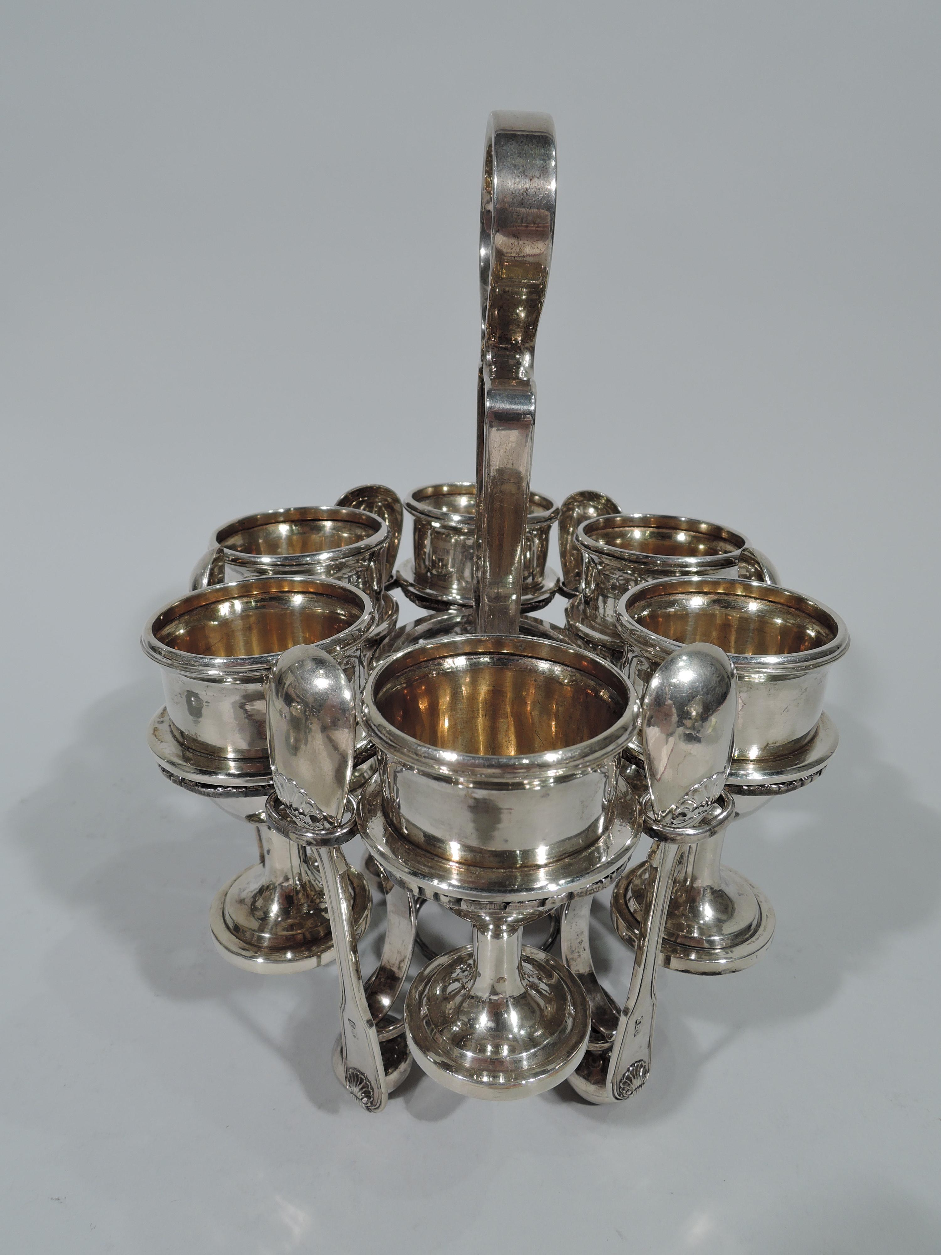 Chinese silver egg stand. Made by Khecheong in Canton, circa 1840. Stand comprises 6 tooled rings alternating with six small ovals mounted to central oval with cruciform stretcher, in turn, mounted to four scrolled supports with ring stretcher and