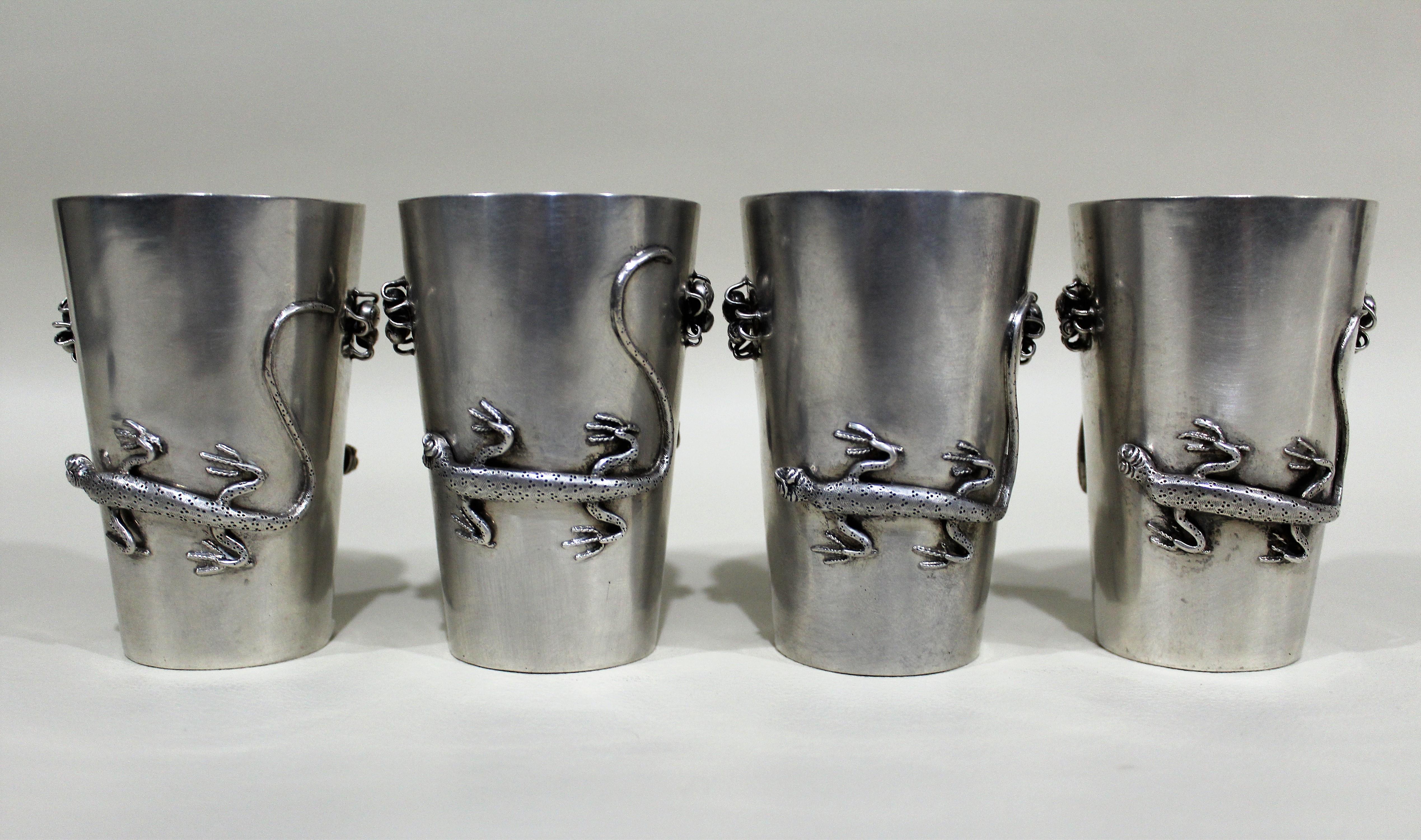Set of four sterling silver antique Chinese export beakers or drinking cups made by the Hung Chong Co. of Shanghai with detailed applied figural decorative salamanders and spiders on alternate sides of each cup. The beakers are clearly hallmarked on