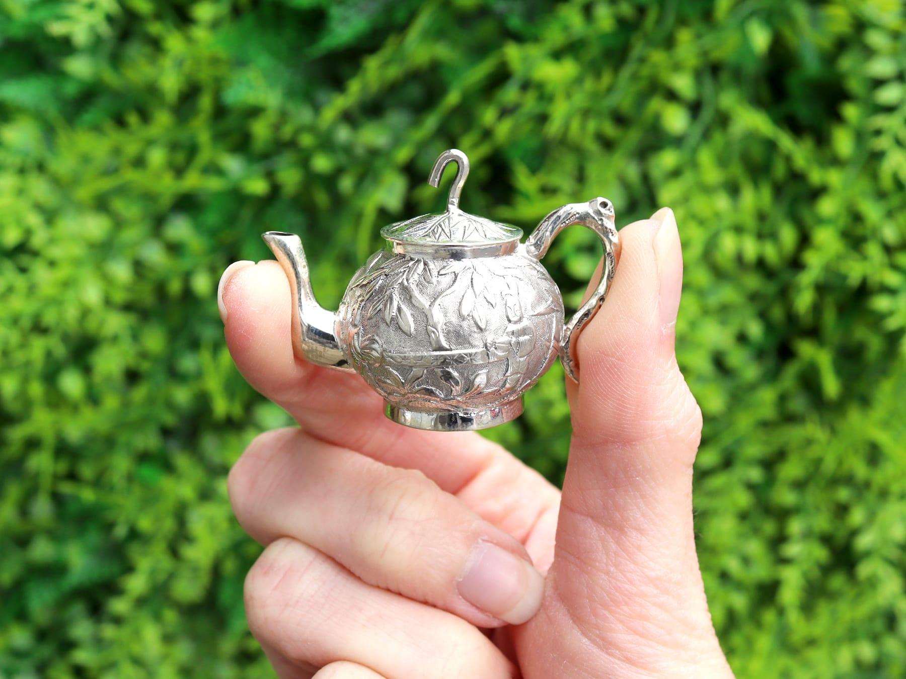 An exceptional, fine and impressive antique Chinese silver miniature three piece tea service; part of our novelty silver collection.

The exceptional antique Chinese silver miniature silver tea set consists of a teapot, cream jug and sugar