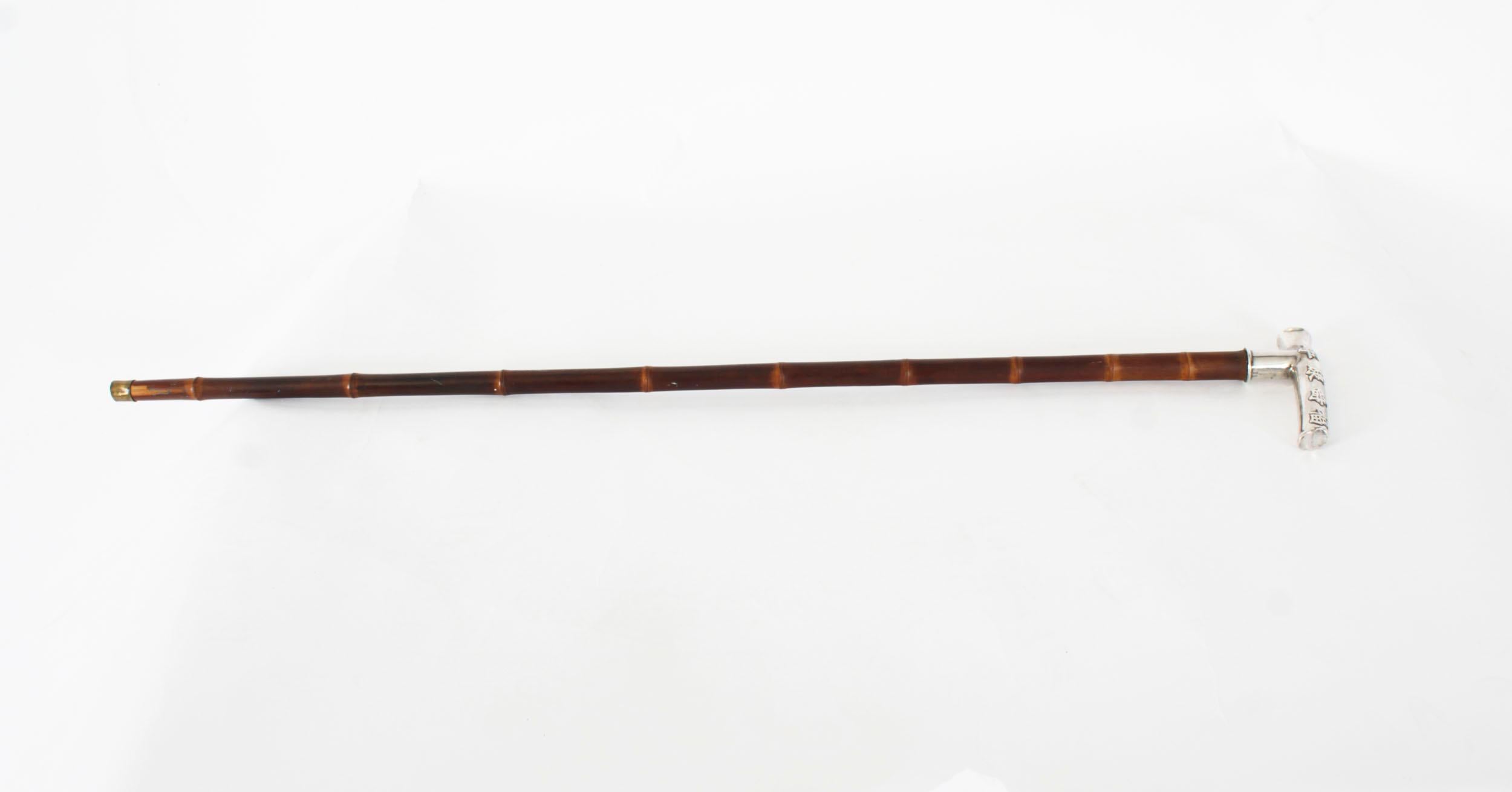 This beautiful antique Chinese silver mounted walking stick is circa 1880 in date and bears Chinese silver hall marks.

It has has an exquisite Chinese silver L-shaped handle decorated with four Chinese characters to each side, on a bamboo shaft