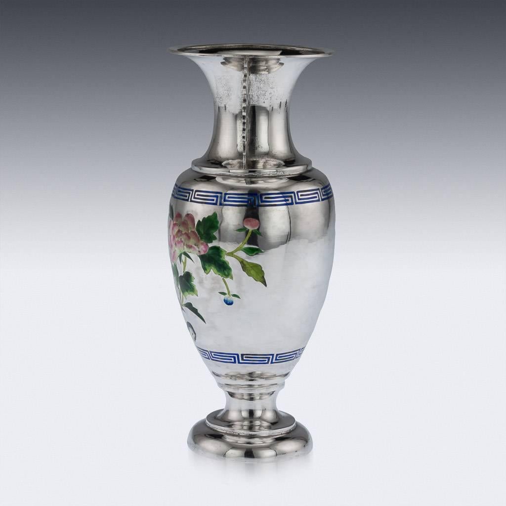 Antique late 19th century Chinese solid silver and enamel vase, the sides are decorated with shaded enamel, depicting blooming chrysanthemums and an exotic bird, cross-key boarders and applied with pierced floral handles. The vase is of good