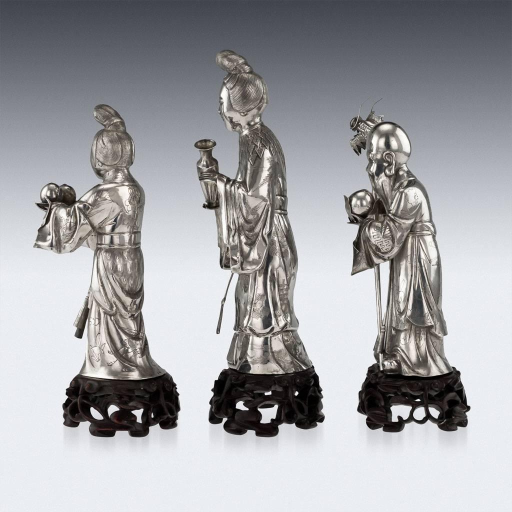 Description
Antique 19th century Chinese extremely rare solid silver statues set of three immortals on carved wooden stands depicting; two figures of He Xiangu, standing with a vase in hand and other with peaches, He Xiangu translates as 
