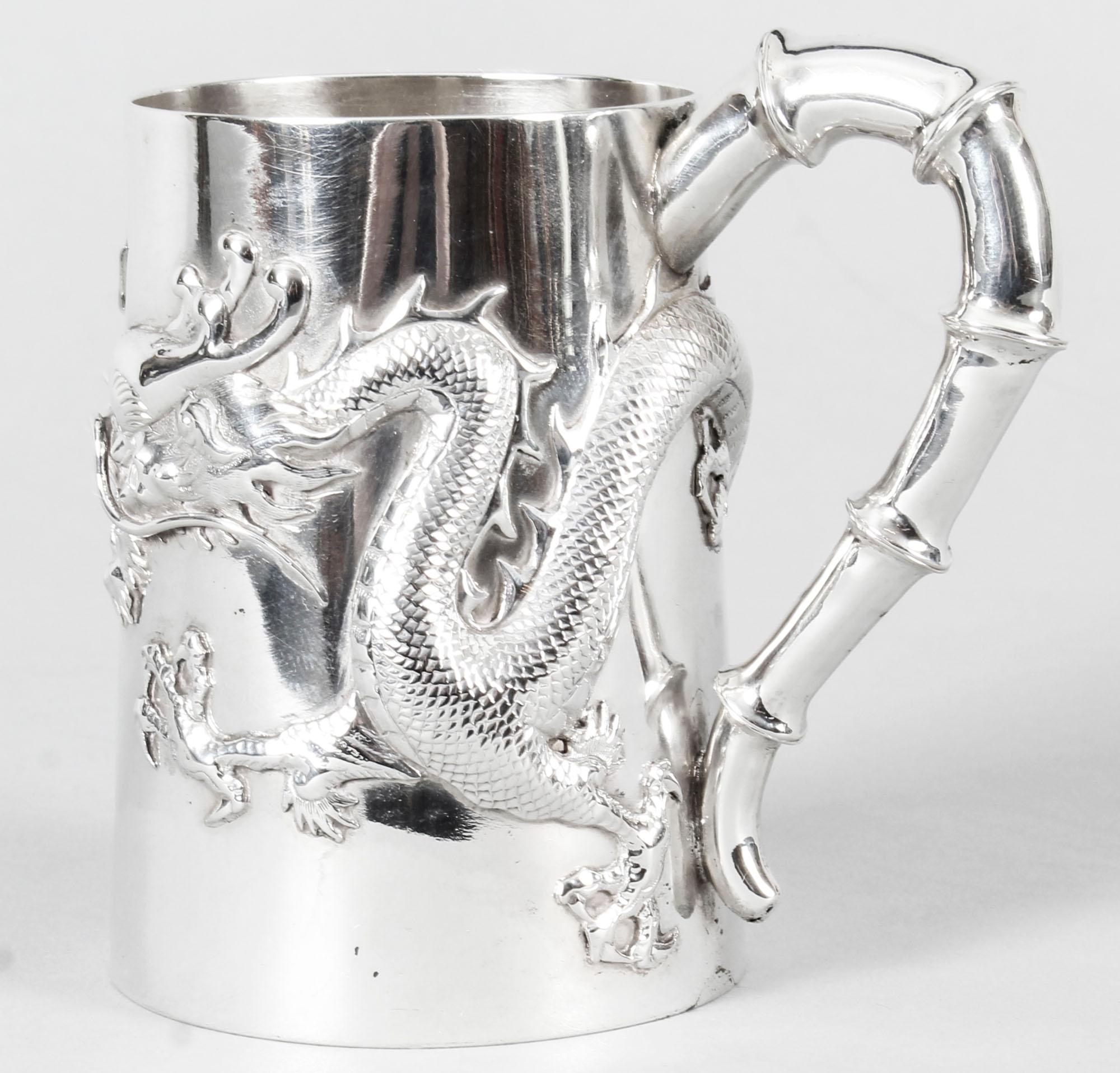 This is a magnificent antique Chinese export solid silver mug, with hallmarks for Hung Chong, Canton & Shanghai, circa 1900 in date.

This stunning silver mug has a slender tapering cylindrical body which is masterfully chased with the legendary