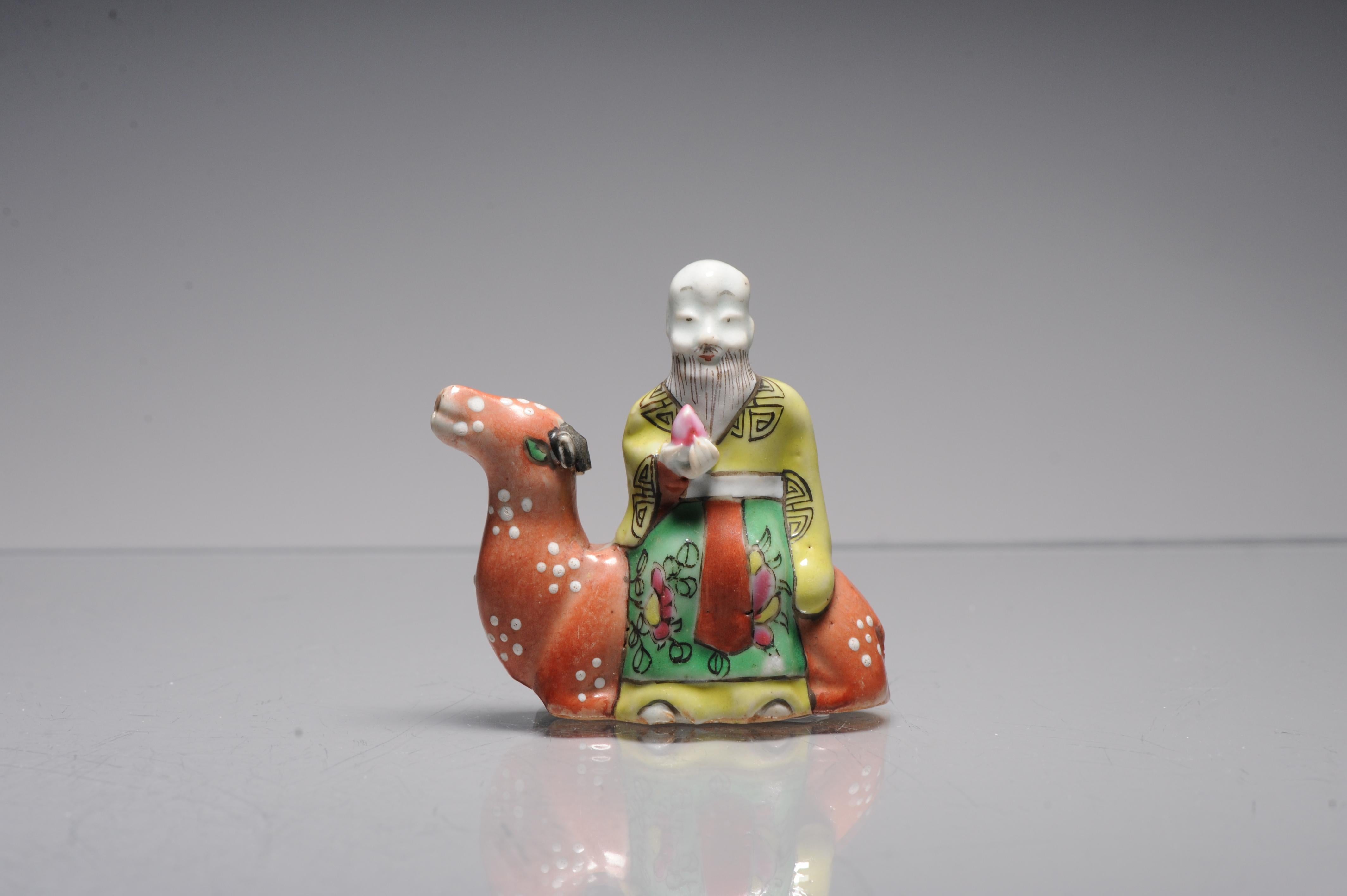 Description

An unusual Chinese export porcelain Famille Rose model of an immortal on the back of a sitting camel. It seems to be a water dropper considering the hole in the mouth of the camel and the one at the back. Qianlong/Jiaqing