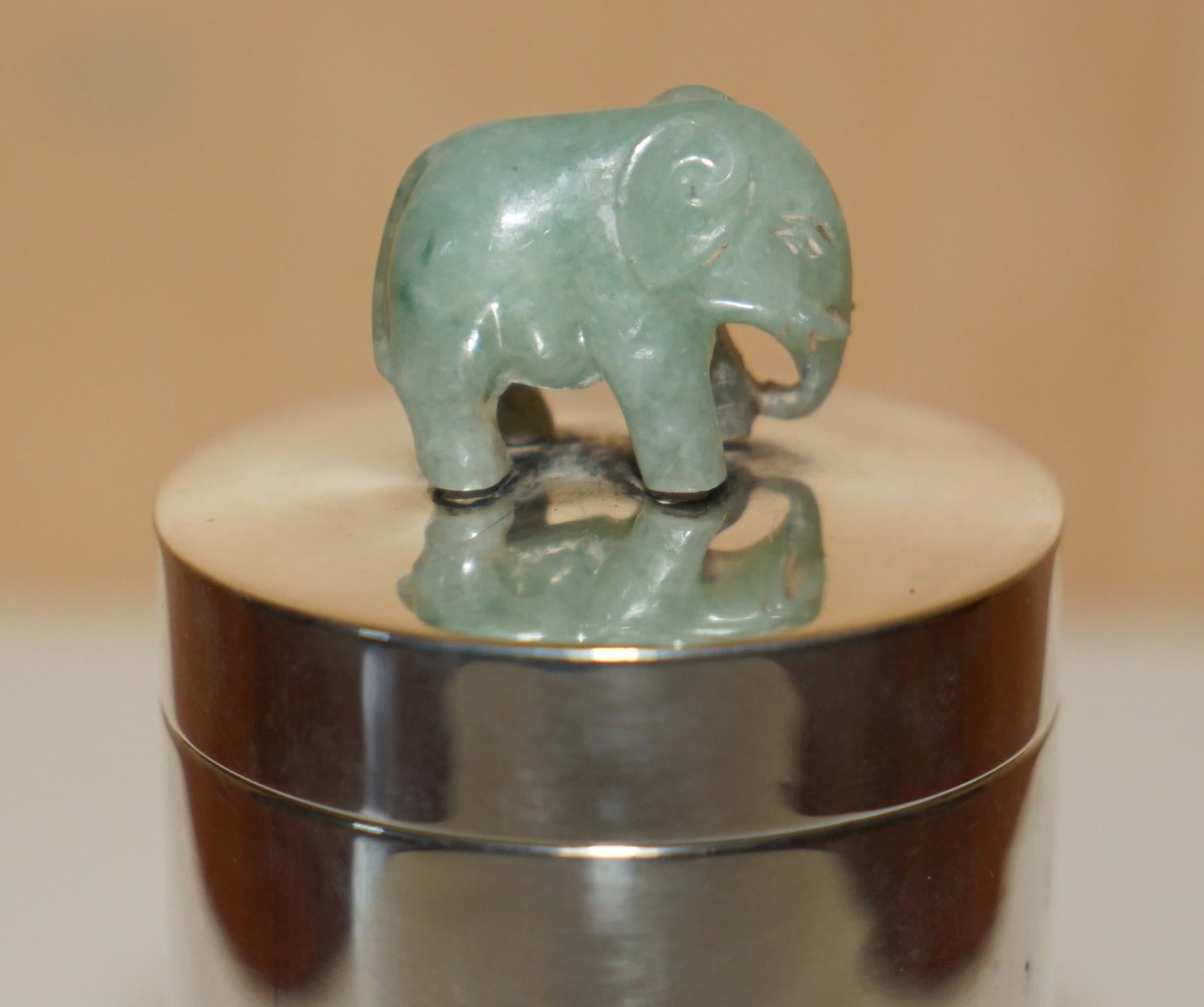 Royal House Antiques

Royal House Antiques is delighted to offer for sale this lovely antique Chinese Sterling silver pot with hand carved Jade elephant on top

A very good looking well made and decorative piece, I have never seen another like it,