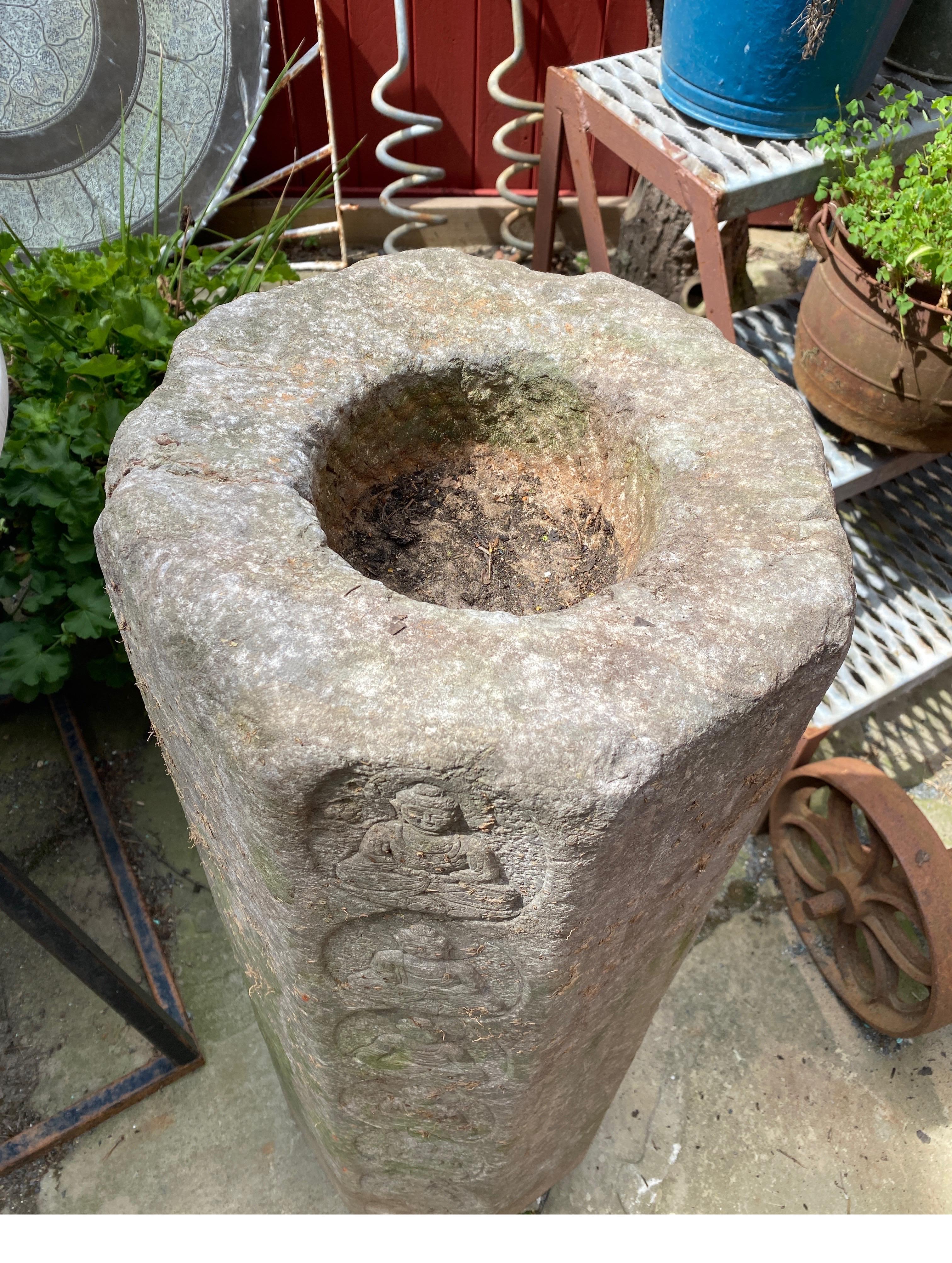 An Antique Chinese Solid gray stone hand carved offering sculpture.  The octagonal shape with hand carved Buddha enlightenment pictures with faint calligraphy on the sides.  The solid stone with a carved bowl opening at the top, we are listing as