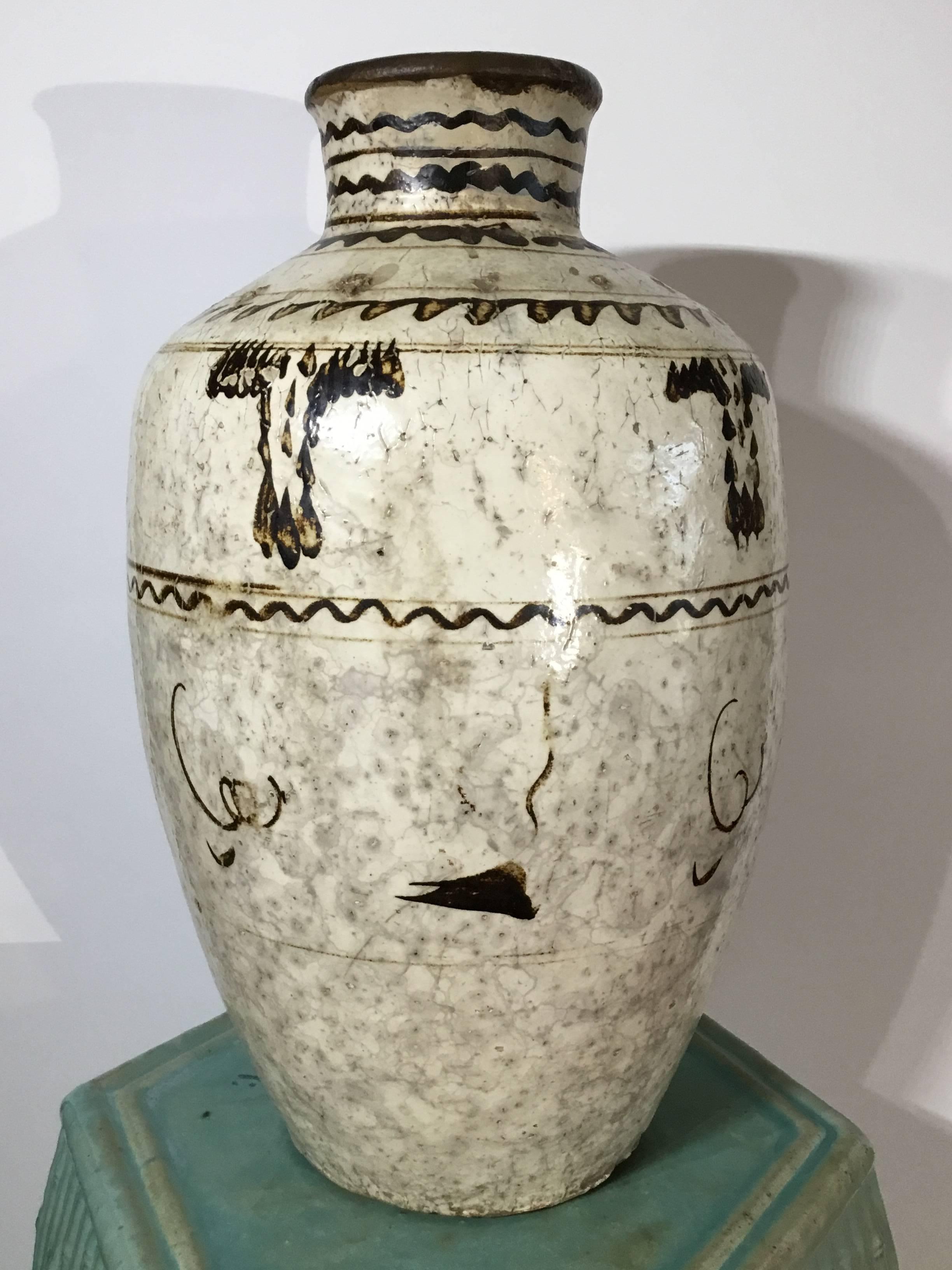 Beautiful stoneware Chinese jar, hand-painted and glazed, decorated
with Chinese motifs or calligraphy like, to make exceptional object of art.
Two more available.