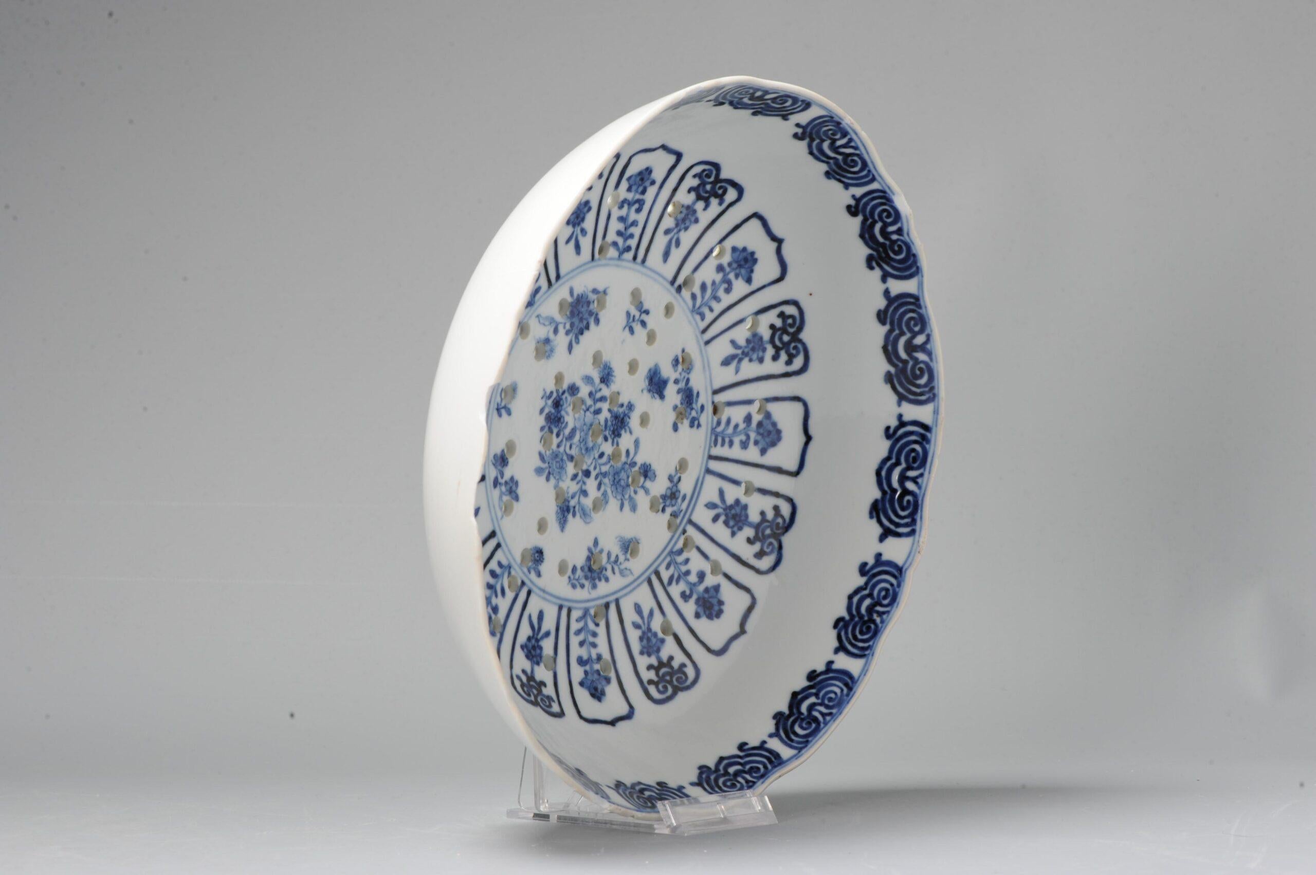 A nice strainer. Qing Dynasty - Qing Period. Central scene of flowers.

Additional information:
Material: Porcelain & Pottery
Color: Blue & White
Region of Origin: China
Emperor: Qianlong (1735-1796)
Period: 17th century
Age: Pre-1800