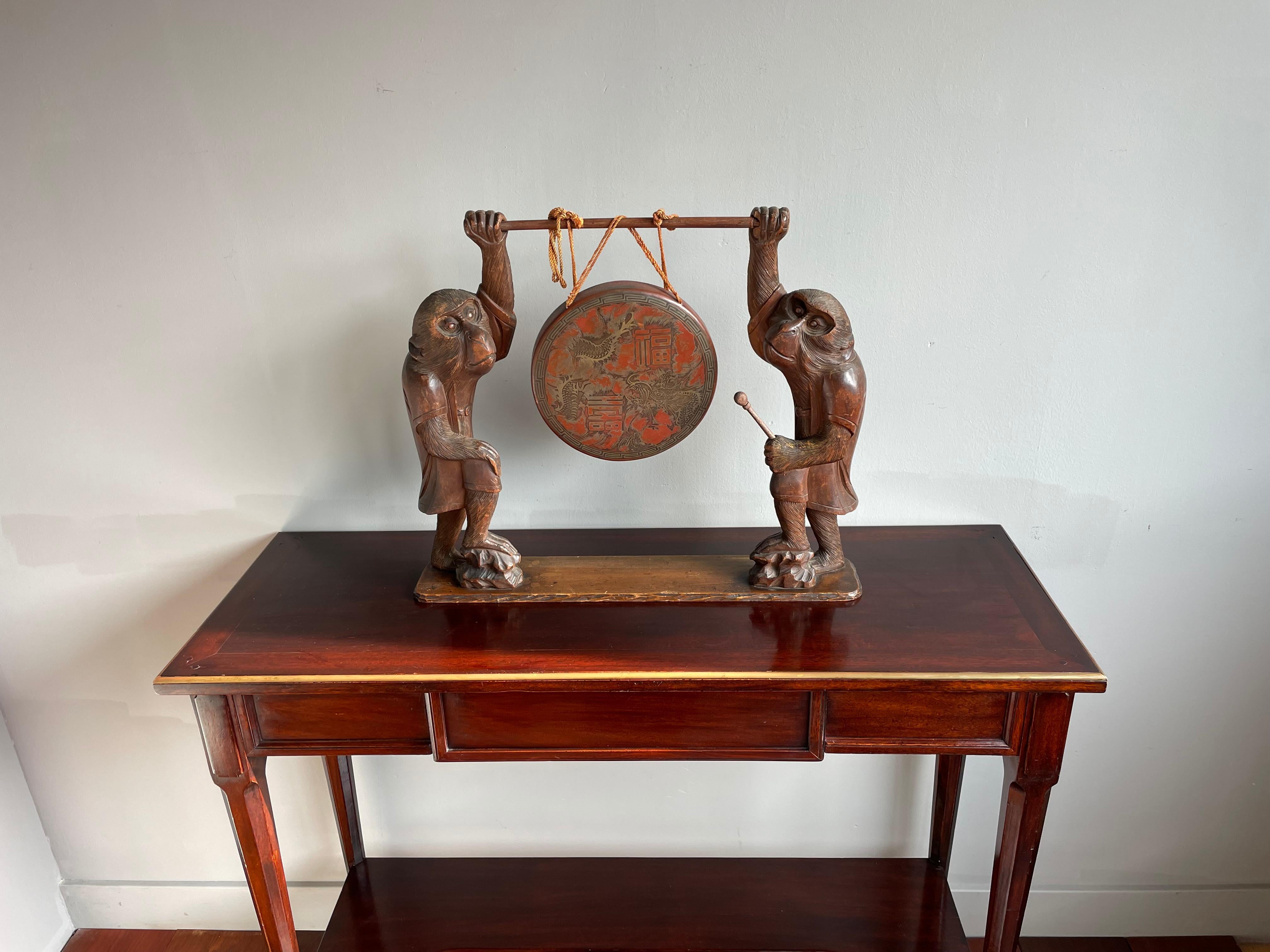 Rare and striking (no pun intended) Chinese bronze or brass gong with etched dragons.

This hand-crafted and sizeable Chinese table gong from the turn of the century (circa 1900) is both practical to use and a beautiful work of art to look at. The