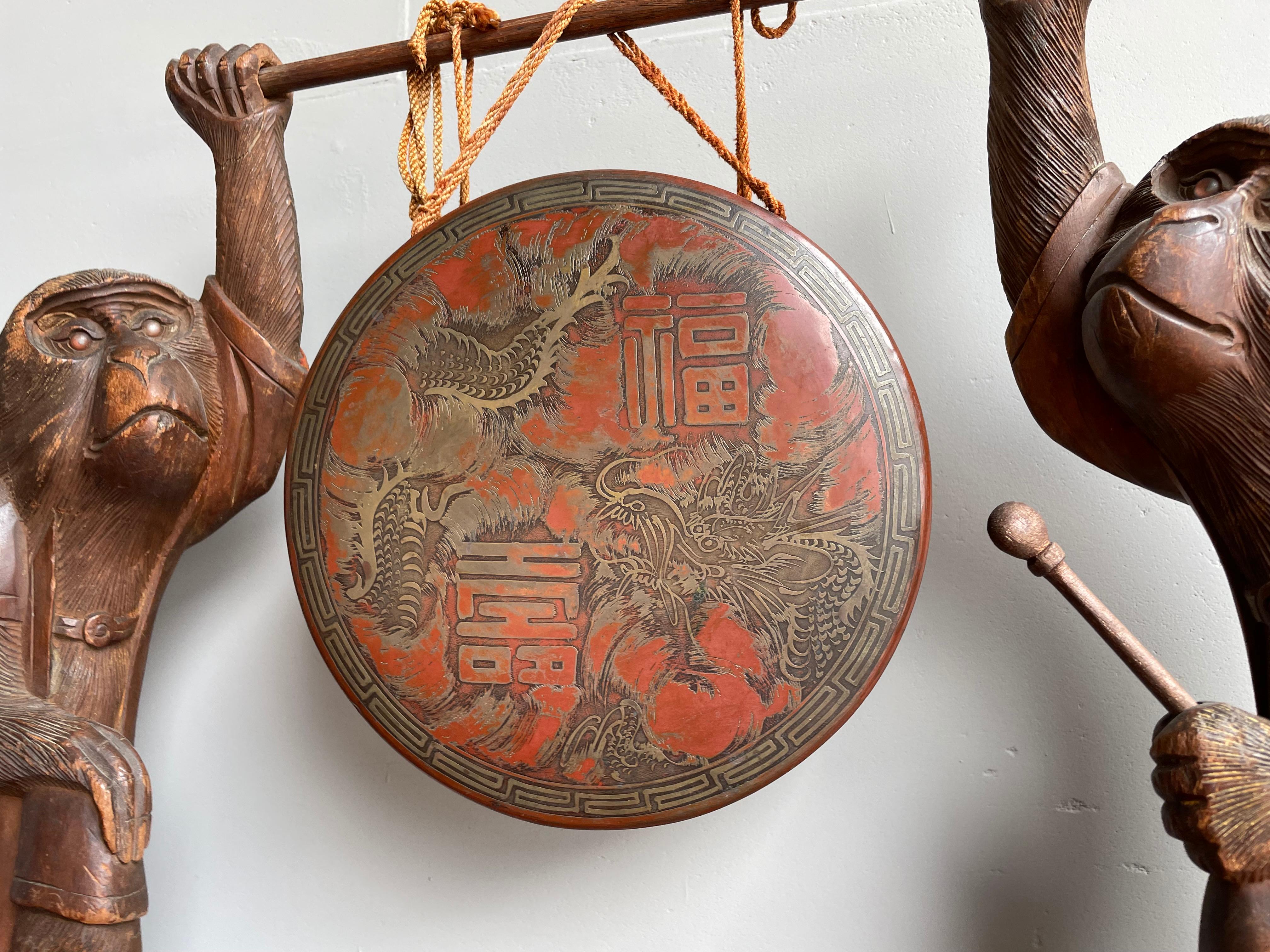 Hammered Antique Chinese Table Gong Held Up by Two Hand Carved Wooden Monkey Sculptures