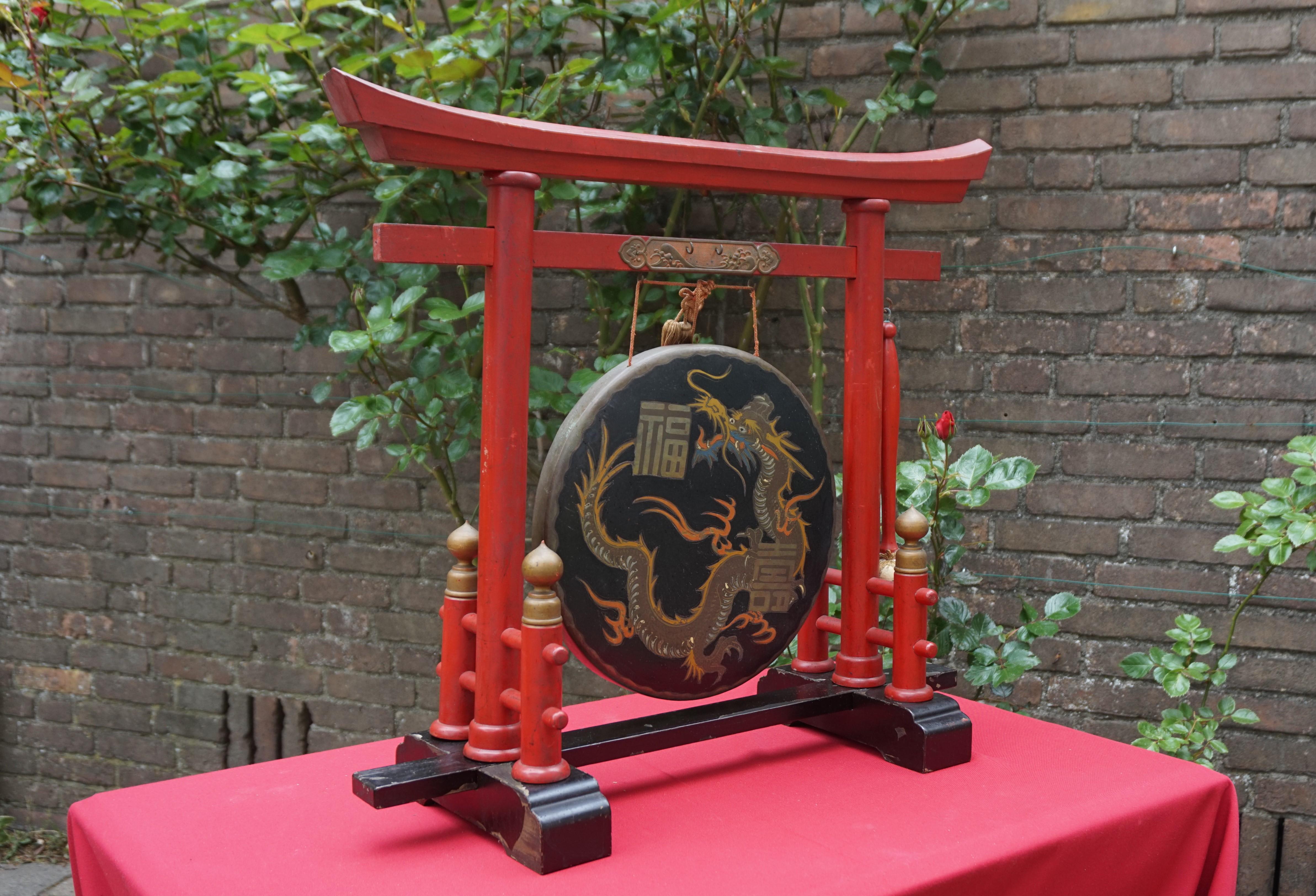 Rare and striking (pun intended) Chinese gong.

This hand-crafted Chinese gong from the early 1900s is both practical to use and beautiful to look at. The gong itself is wonderfully decorated with a hand-painted dragon and two Chinese symbols that