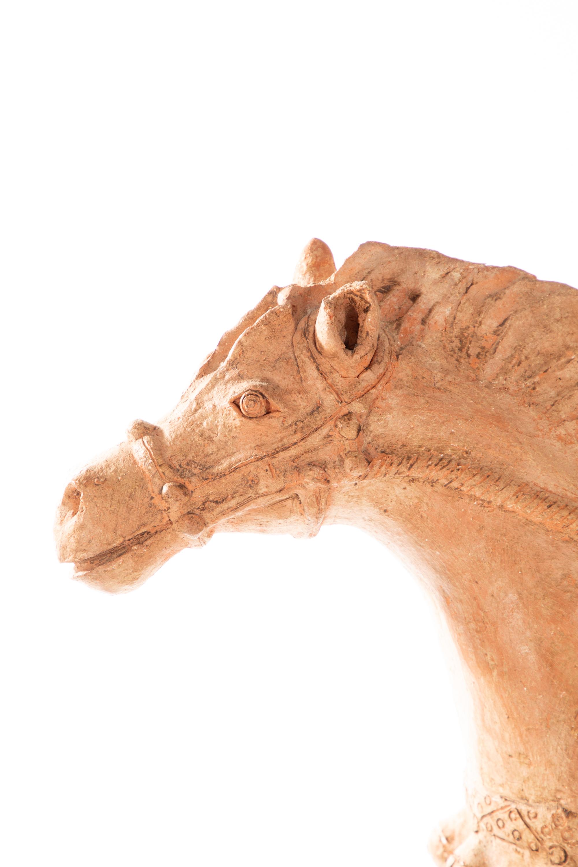 19th Century terra cotta figure of a horse and rider.