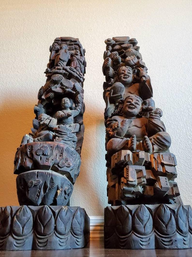 A majestic pair of antique architectural salvaged Chinese temple corbels, now mounted as one-of-a-kind wooden sculptures on custom floor standing display pedestal stands. 

Originally commissioned for an important religious temple in China, the