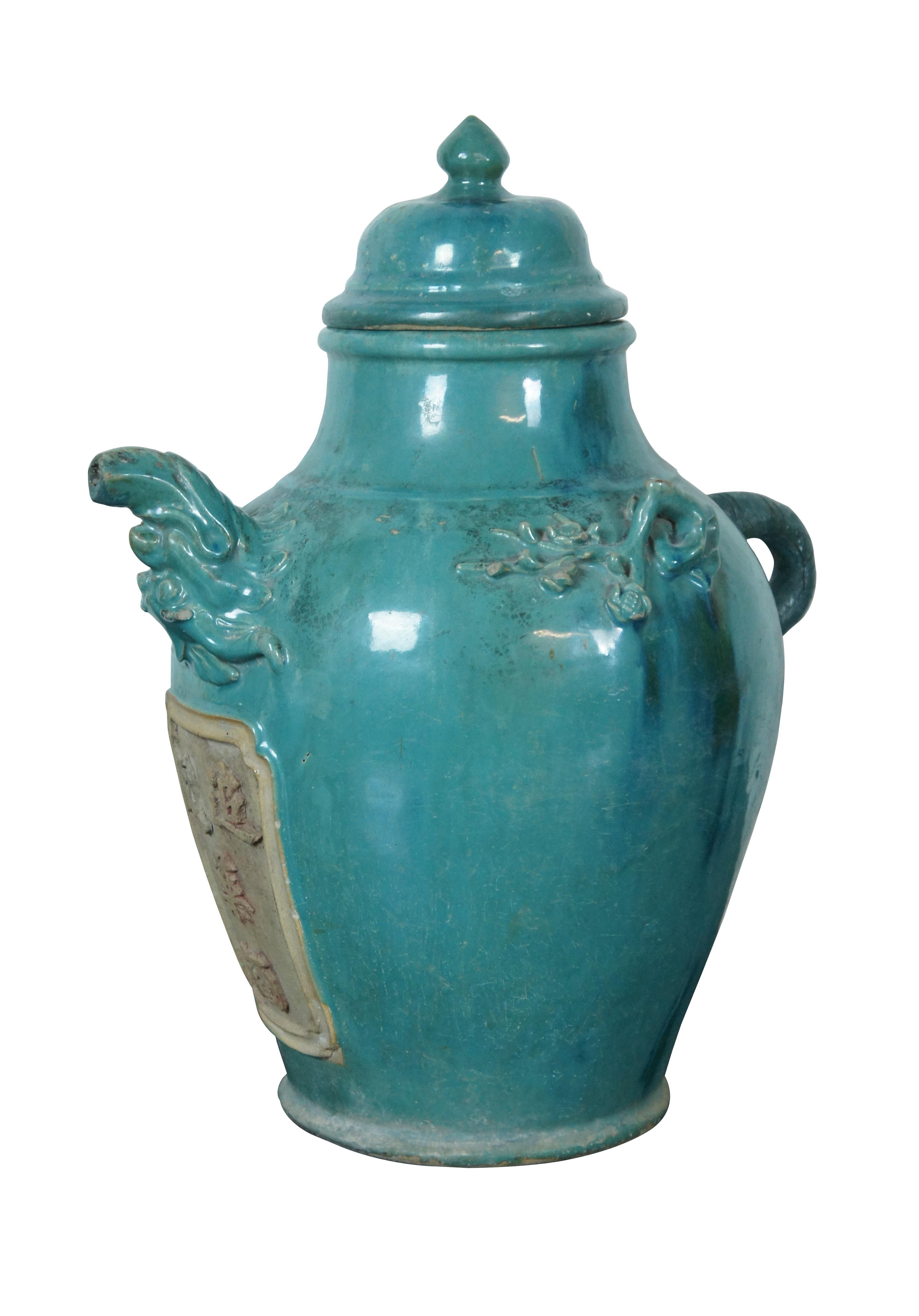Antique Chinese Chinoiserie medicine or wine jug / mantel urn / jar - turquoise / blue-green glaze with small handle, upside down dragon head spout, ginger jar shaped lid, and plaque on front.

Dimensions:
17