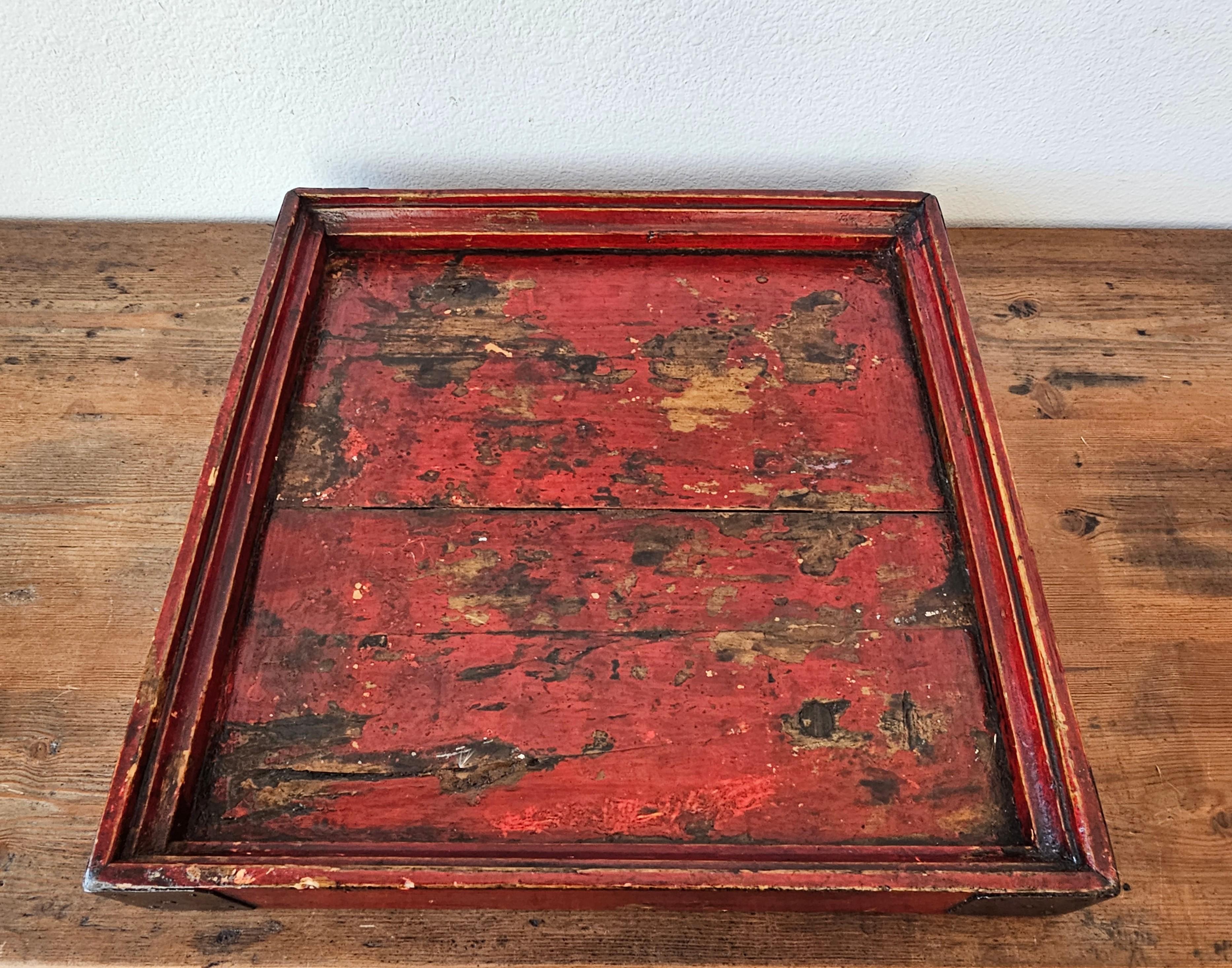 Charming antique Chinese oxblood red lacquer square solid wood tray with forged iron metal reinforced corners and beautifully aged warm rich dark heavily worn distressed patina and lustrous sheen.

A remarkable wabi-sabi style table tray, highly