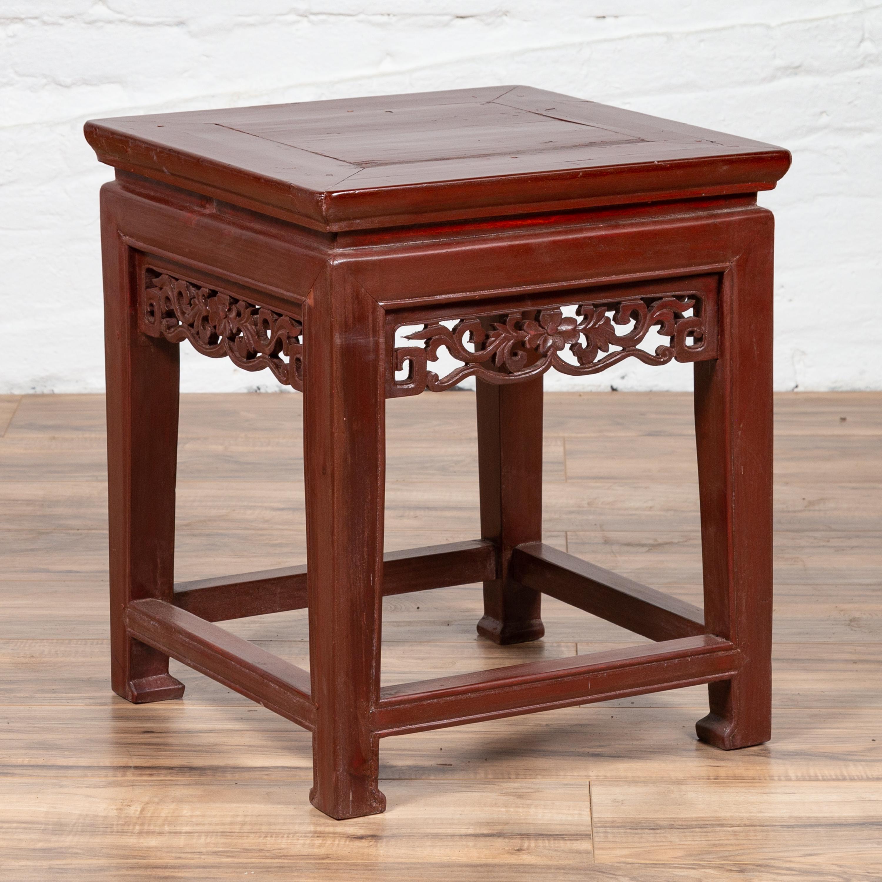 Antique Chinese Waisted Stool with Dark Red Patina and Foliage Hand Carved Apron For Sale 1