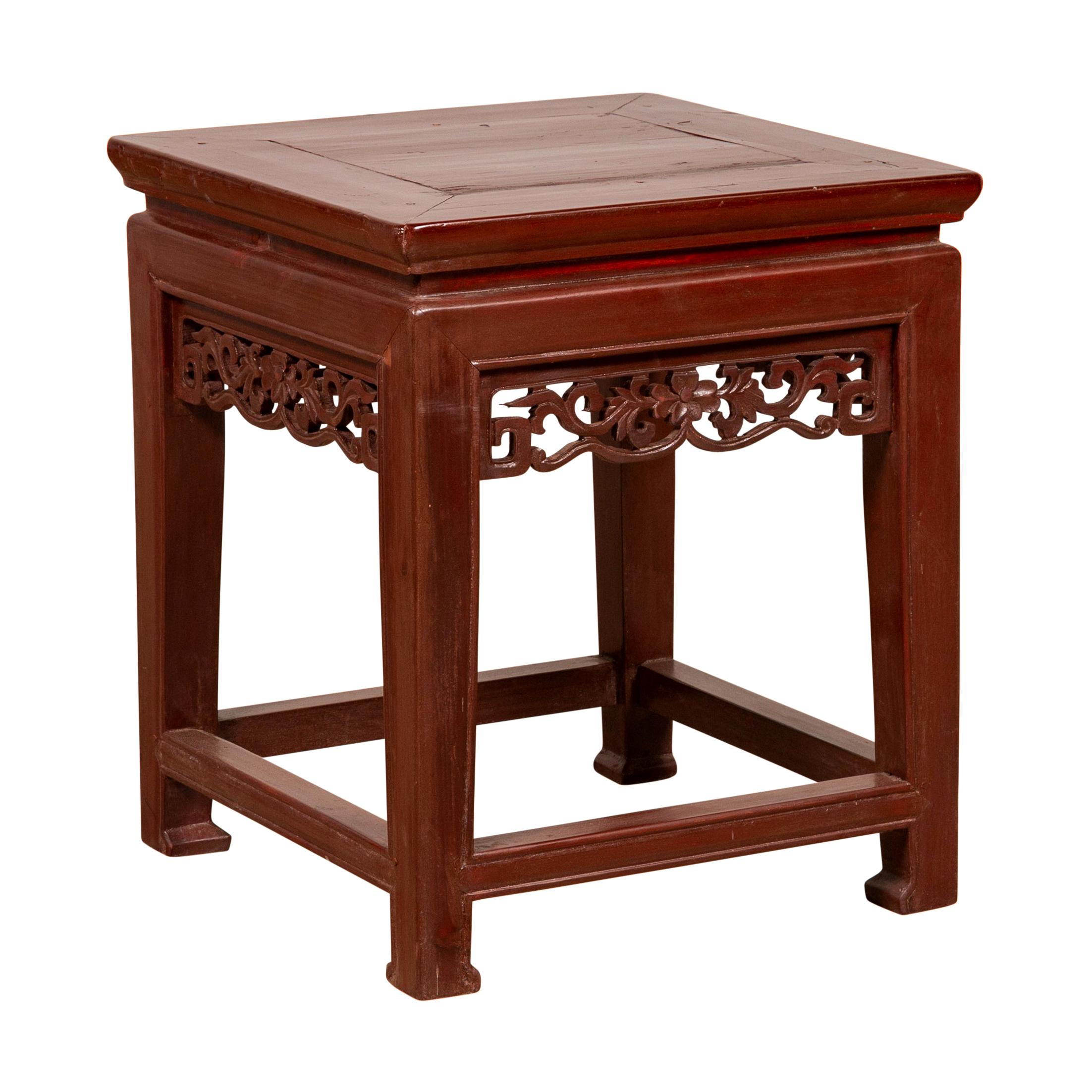 Antique Chinese Waisted Stool with Dark Red Patina and Foliage Hand Carved Apron For Sale