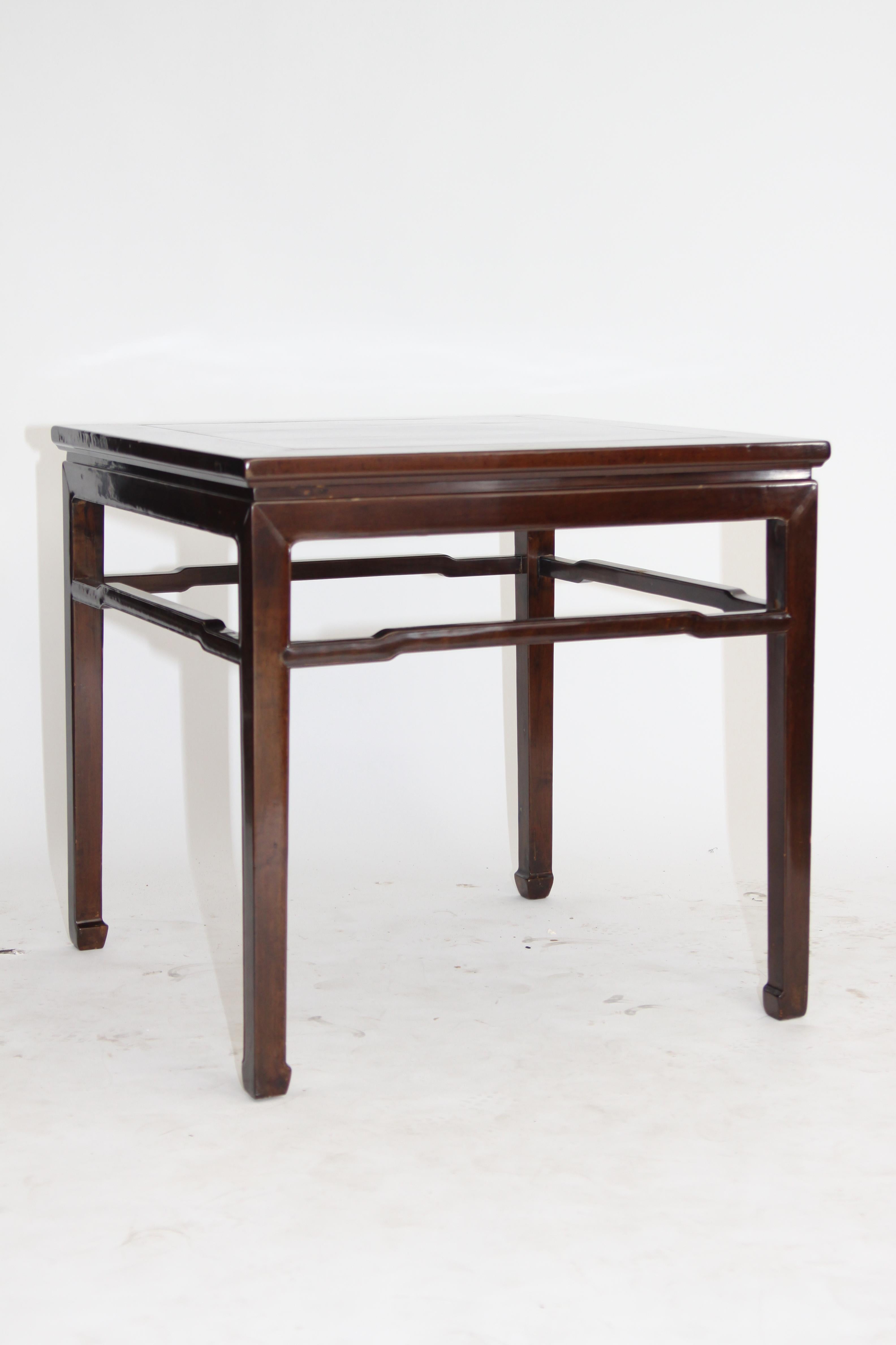 FINE SQUARE TABLE

The table with a floating top panel, enclosed within an ice-plate edged frame, above a waist and plain apron, supported on square-sectioned legs, braced with humpback stretchers, the legs tapering to end in horse hoof