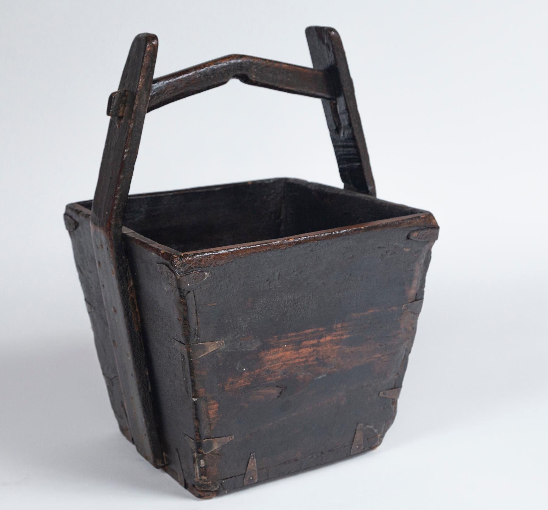 Antique Chinese Water Bucket, early 20th Century. Aged patina with original iron fittings.