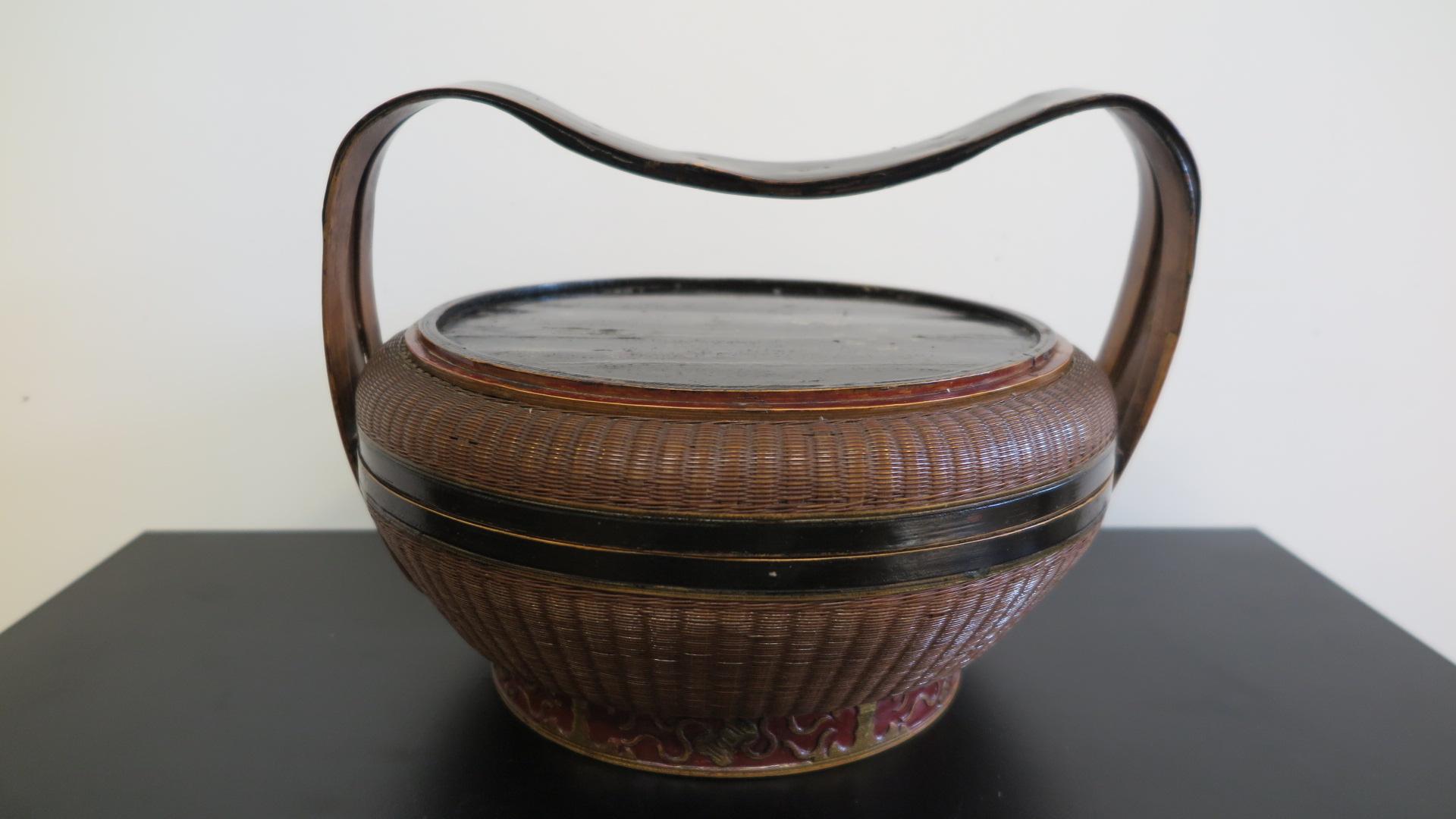 Antique Chinese wedding basket of woven rattan and bamboo. Called a wedding basket as gifts from the wedding are collected and offered in such types of baskets. Completely hand made involving intricate weaving skills for a specific event. Lightly