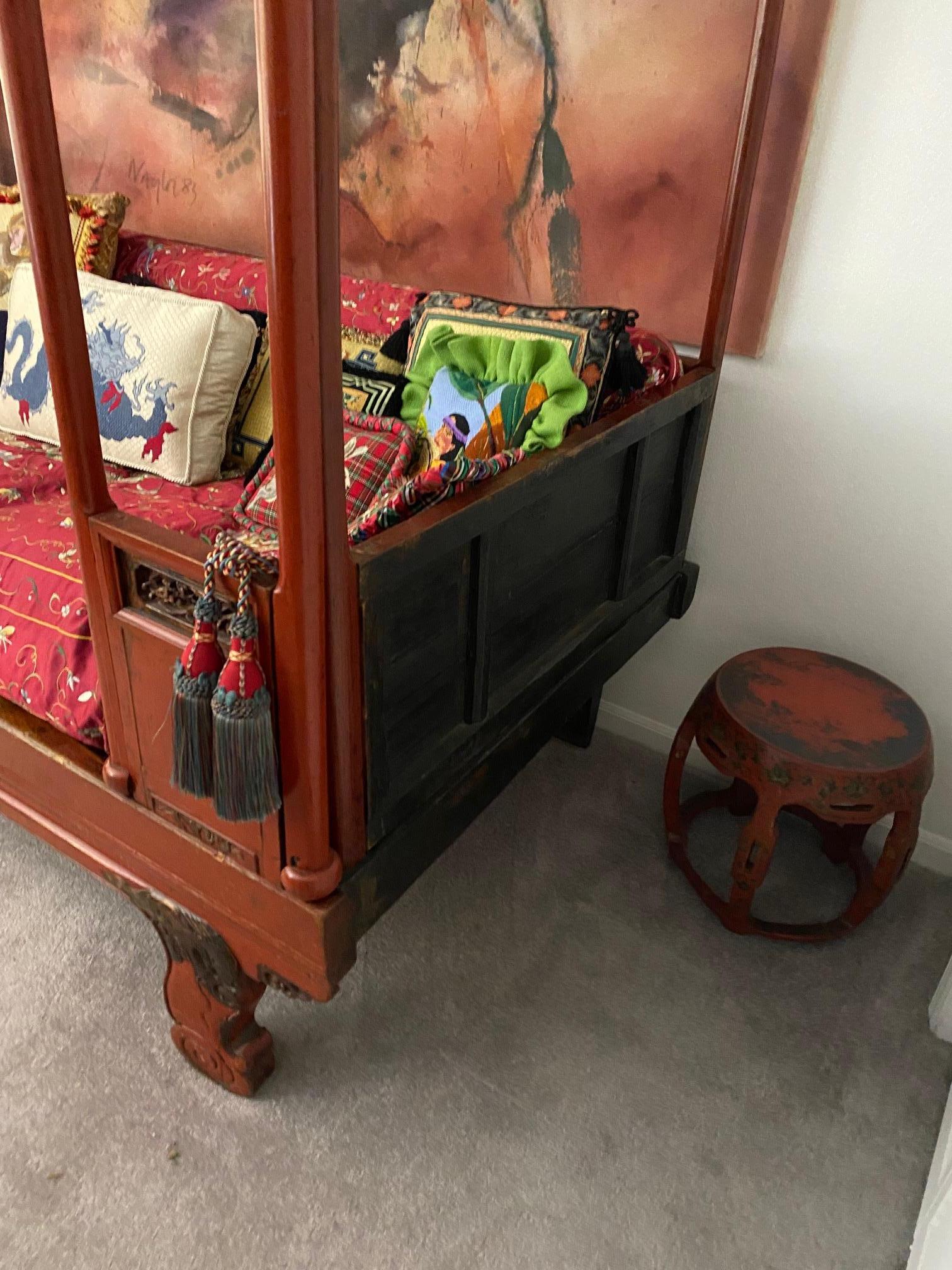 This Chinese red lacquered wedding bed is hand crafted, hand carved lacquered and gilt gold. At the top it depicts boy meeting girl, boy dances for girl, boy ask for her hand from father and then marriage! dragon heads to the from feet. Ju wood made