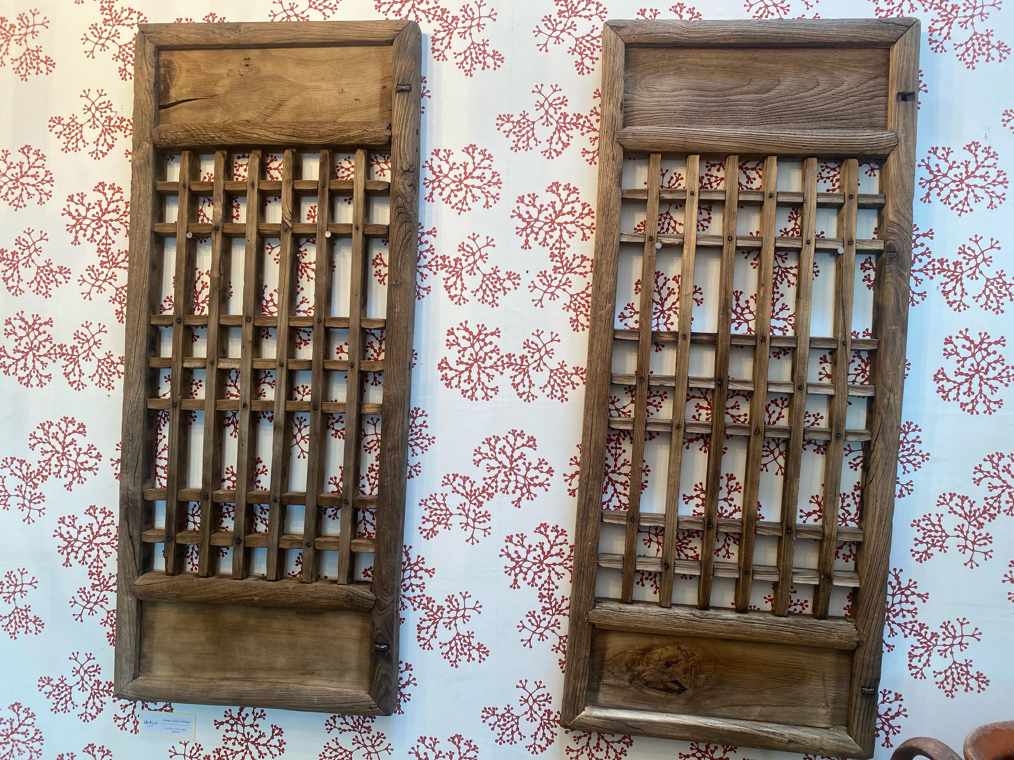 Rustic and absolutely stunning one-of-a-kind antiques. Chinese Wooden windows make for wonderful wall accents. 

Windows are sold together in a set of 2, we are unable to sell the pieces seperatly.