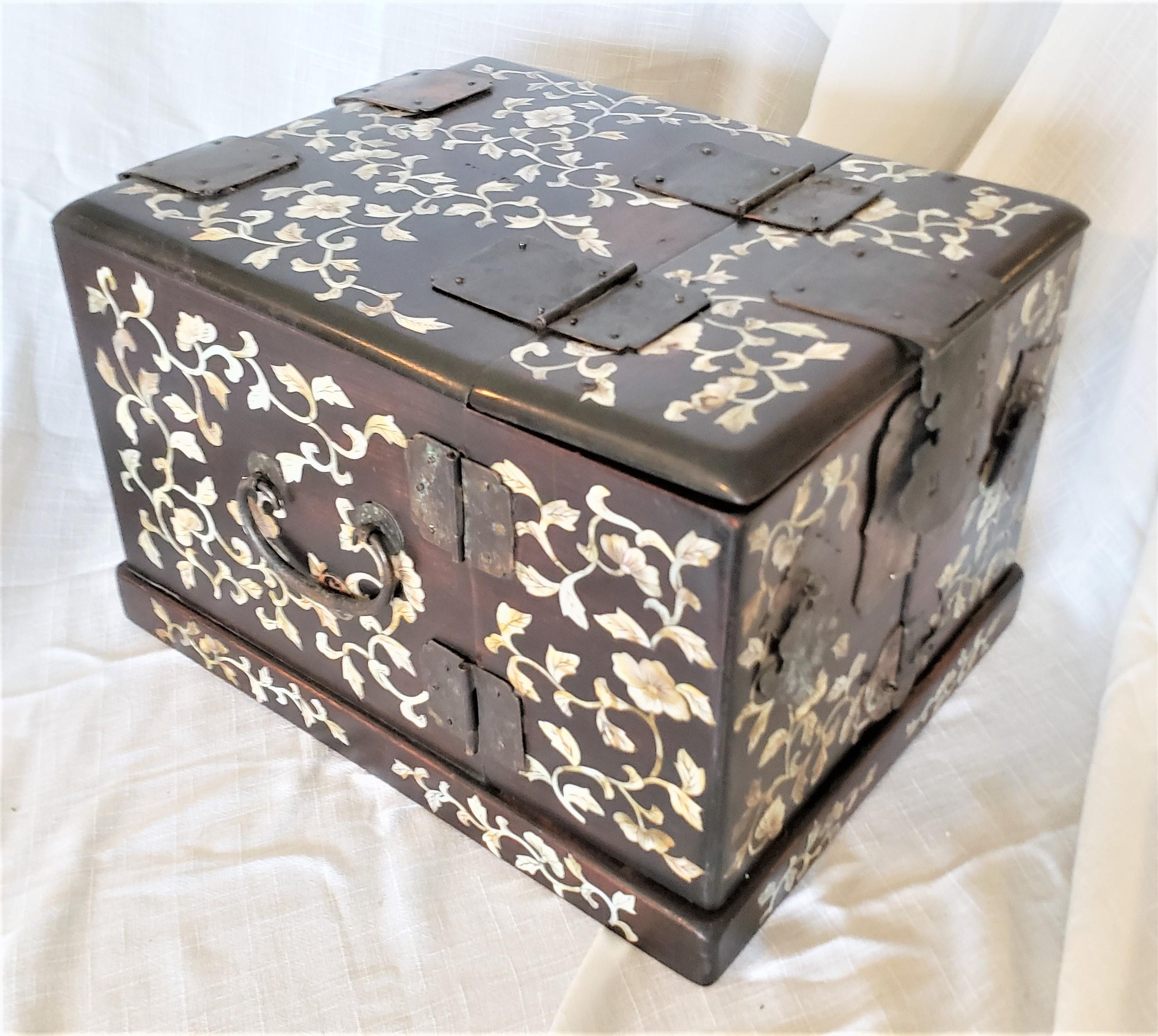 This very elaborate jewelry box or vanity dresser makeup chest is unsigned, but presumed to have been made in China in approximately 1850 in the period Chinese Export style. The box is composed of wood with multiple small drawers and compartments