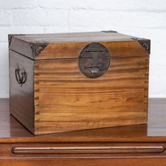 Antique Chinese Wooden Treasure Chest with Cutout Metal Braces and Dovetails