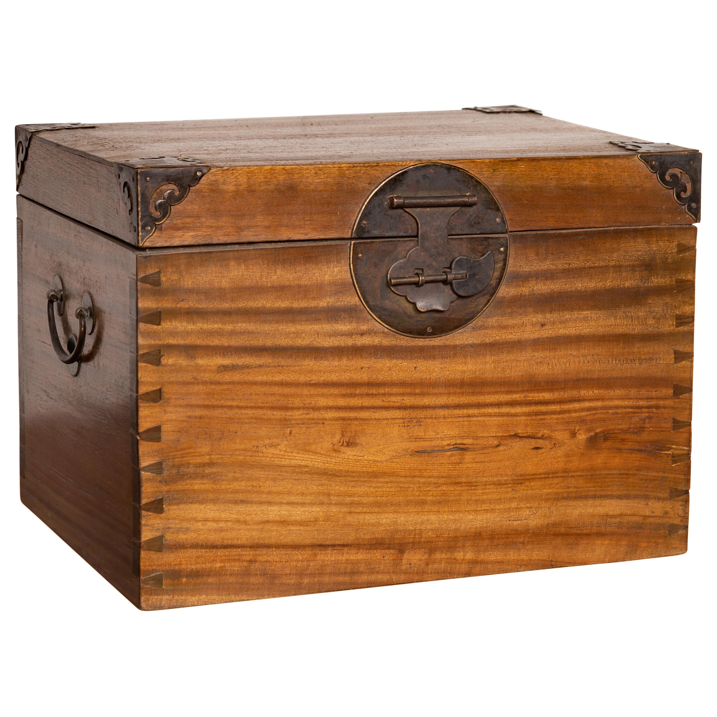 Antique Chinese Wooden Treasure Chest with Cutout Metal Braces and Dovetails