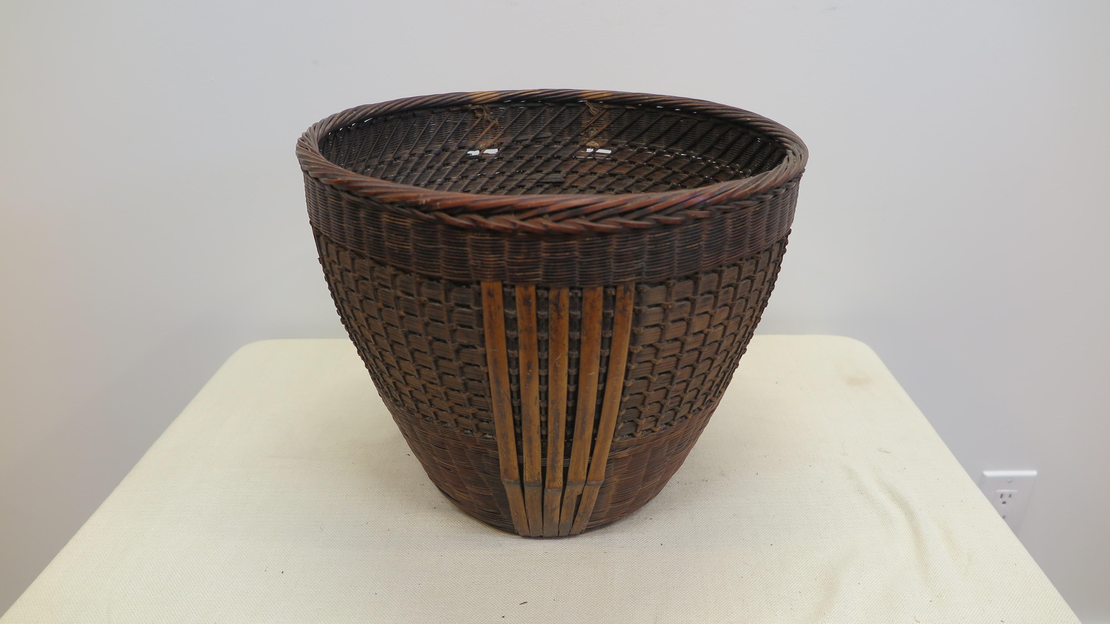 Antique Collection Basket. Antique Chinese Woven Basket. Beautifully hand-woven large rattan and bamboo collection basket. Used to gather and hold fruits, apples, pears, pomegranates and gourds. This example exhibits a masters ablilty to weave reed