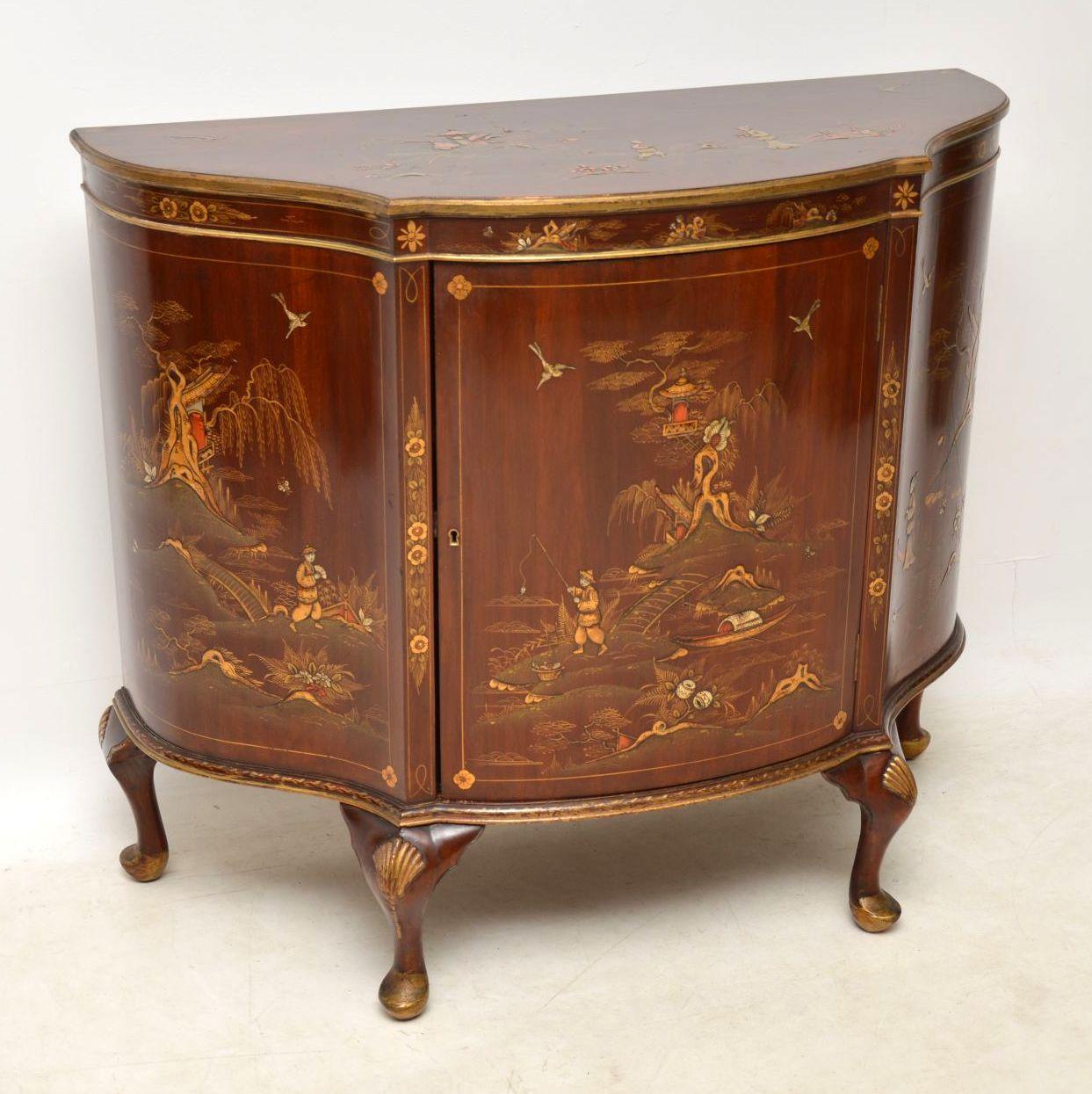 Antique chinoiserie and mahogany side cabinet with a serpentine shaped front. The Oriental decoration is all-over the top & the front. It's of very high quality, with lovely colors and various scenes. Please enlarge all the images to see it all in