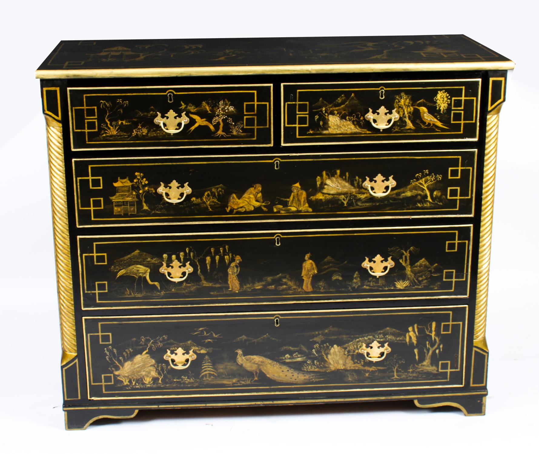 This is a stunning antique Georgian Chinoiserie black lacquered commode, circa 1825 in date.

A pair of twisted scalloped columns frame two short drawers over three long all decorated with fabulous gilt Chinoiserie decoration in the form of