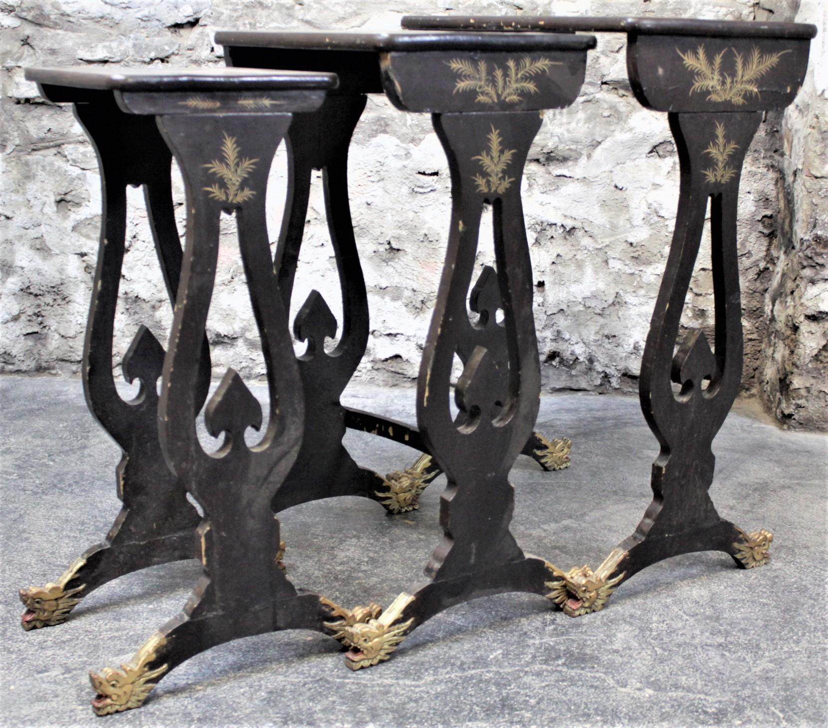 Chinese Antique Chinoiserie Black Lacquered Nesting Table Set with Carved Dragon Feet For Sale