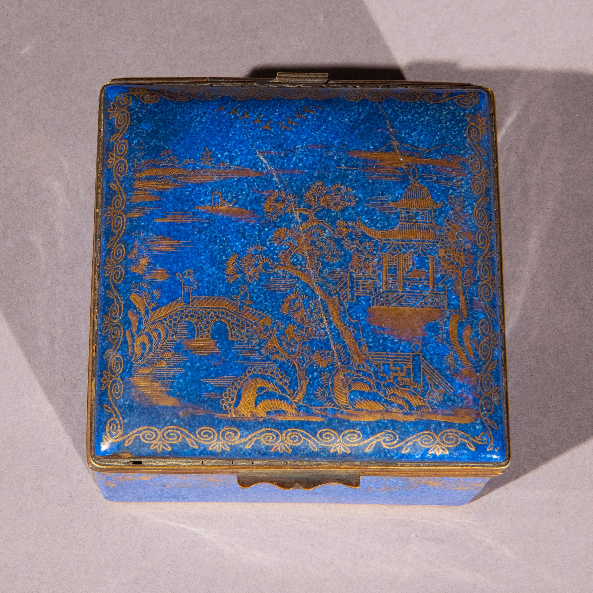 A charming mottled-blue glazed Crown Staffordshire porcelain box in the chinoiserie style
England, circa 1900–1920.

Why we like it
The deep, mottled ‘powder blue’ colour of this charming box, decorated with exotic Oriental designs in gold, is