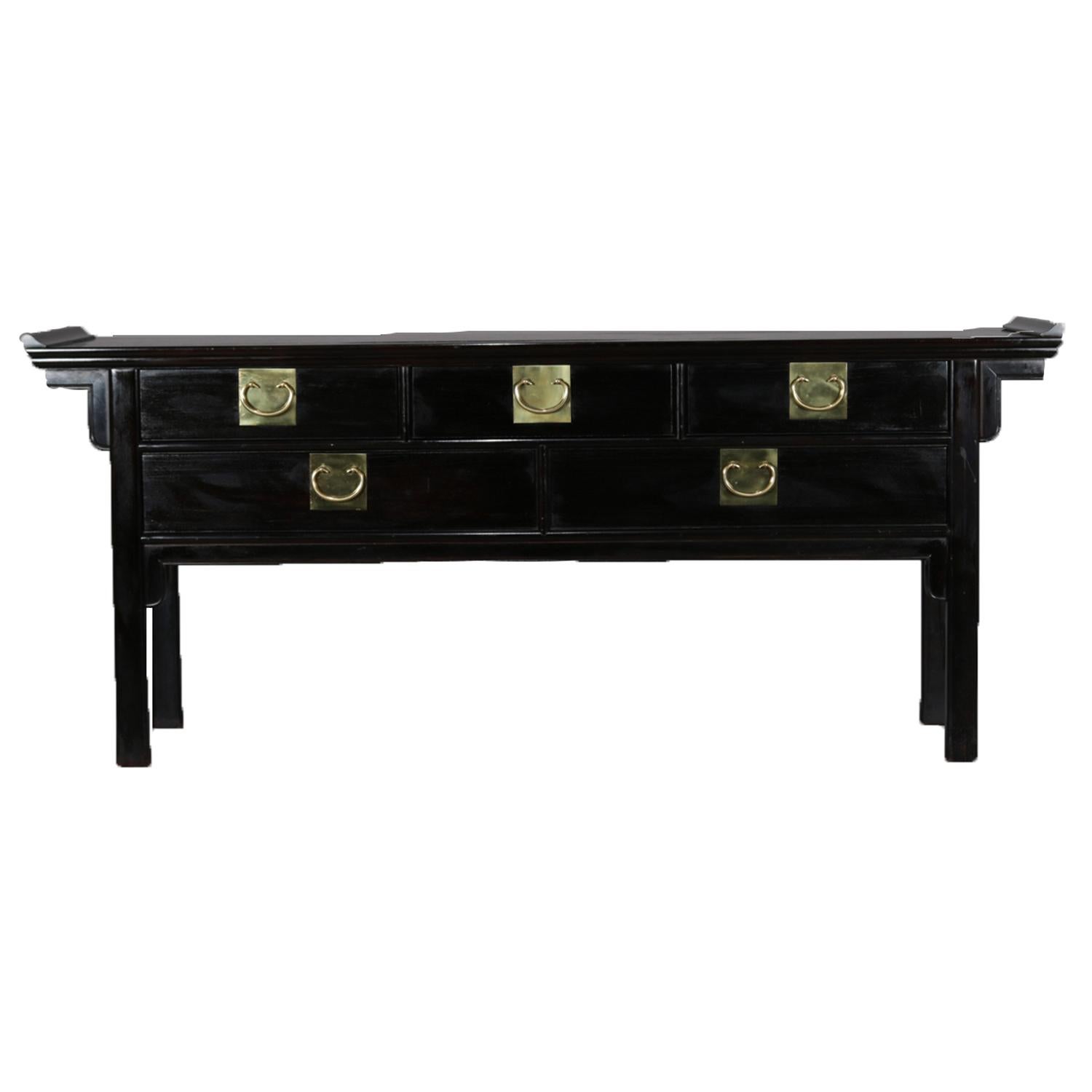 An antique chinoiserie server by Century featuring ebonized finish in stylized pagoda form and having three smaller drawers over two larger drawers with c-scroll brass hardware, original century maker label within drawer, circa 1890.

Measures: