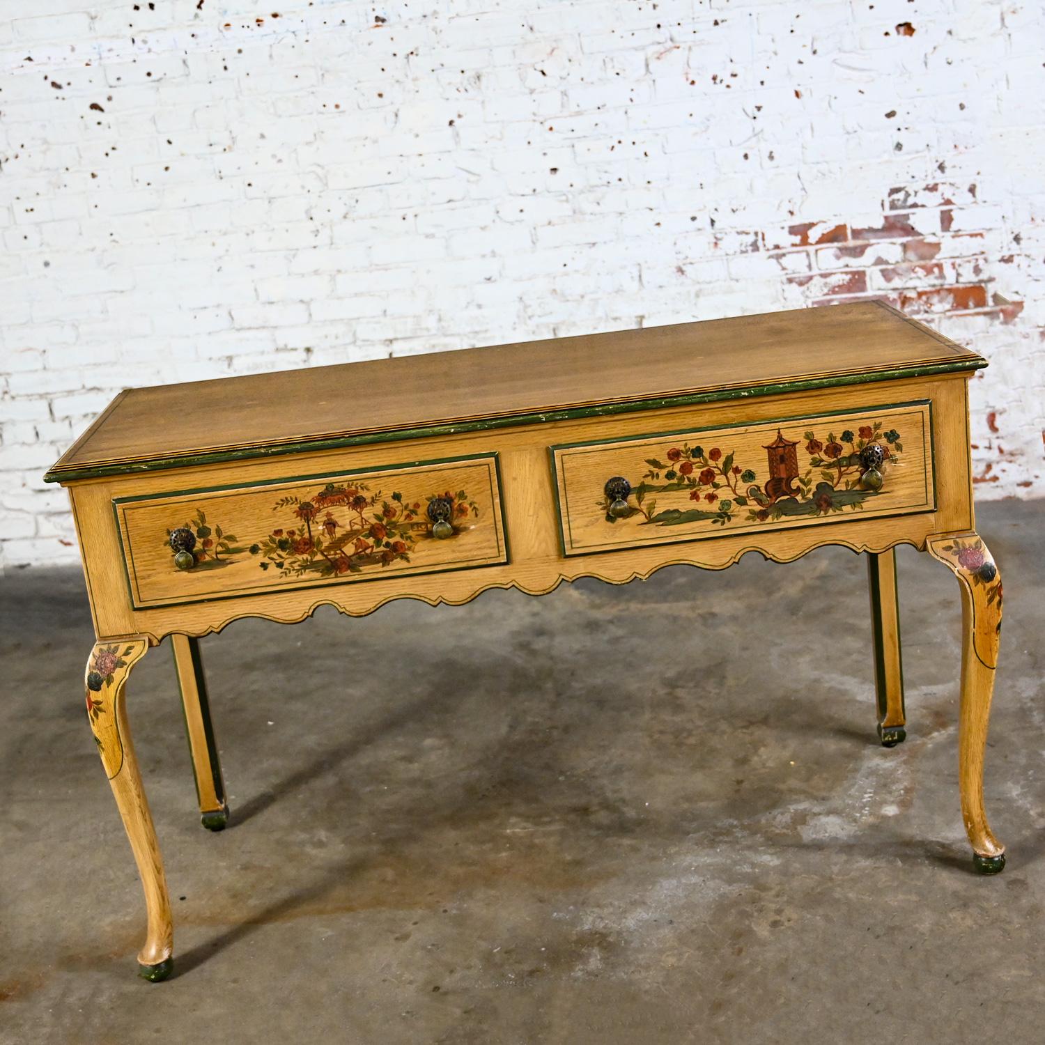 Marvelous Antique Hunt style buffet, sideboard, cabinet, or server comprised of Chinoiserie hand painted details and cabriole legs with ball feet. Beautiful condition, keeping in mind that this is vintage and not new so will have signs of use and