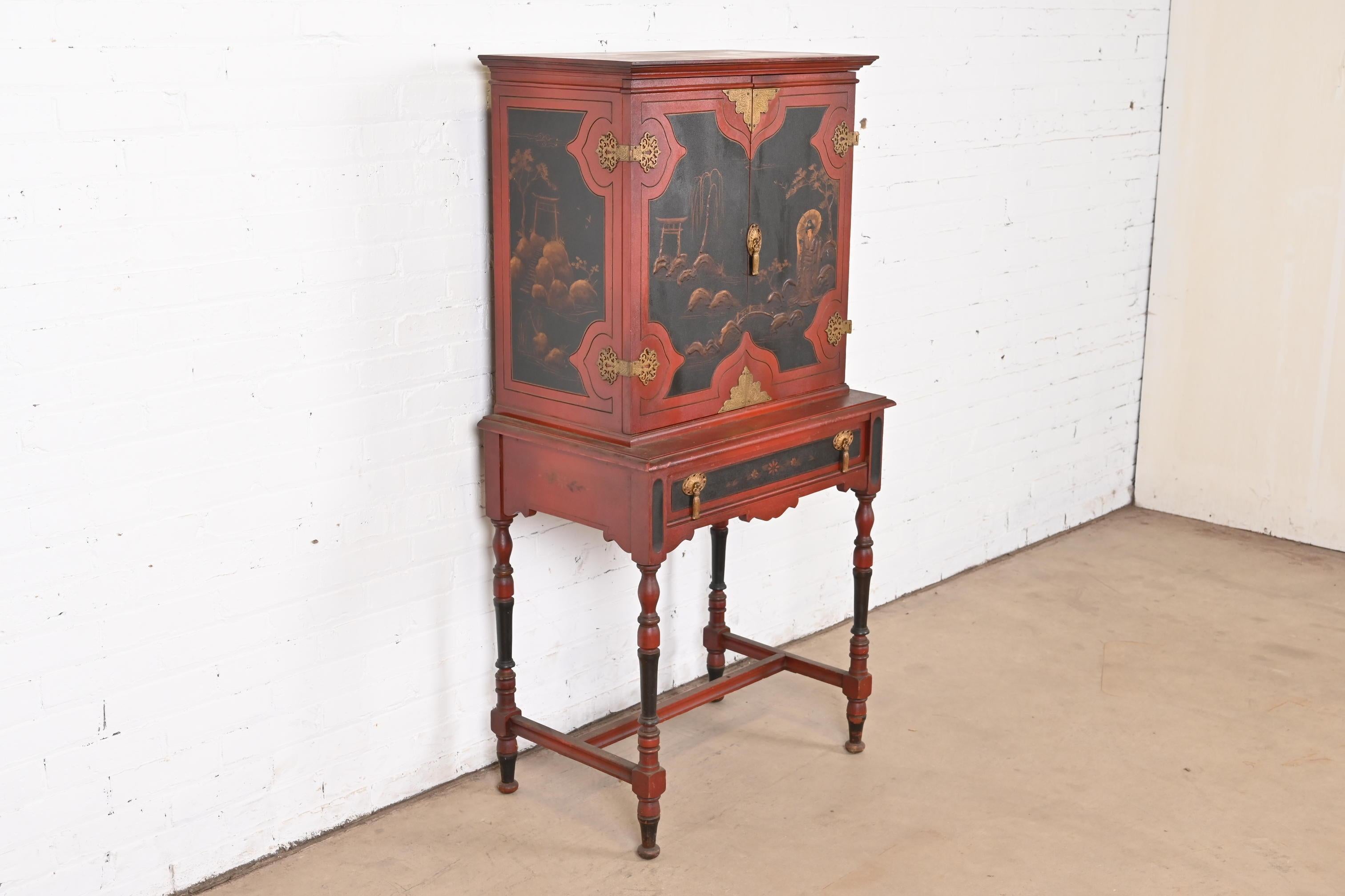 A gorgeous antique Chinoiserie Jacobean style bookcase, dining cabinet, or bar cabinet

In the manner of Baker Furniture

USA, Circa 1920s

Red lacquered carved walnut, with hand painted Chinoiserie scenes, and original brass hardware.

Measures: