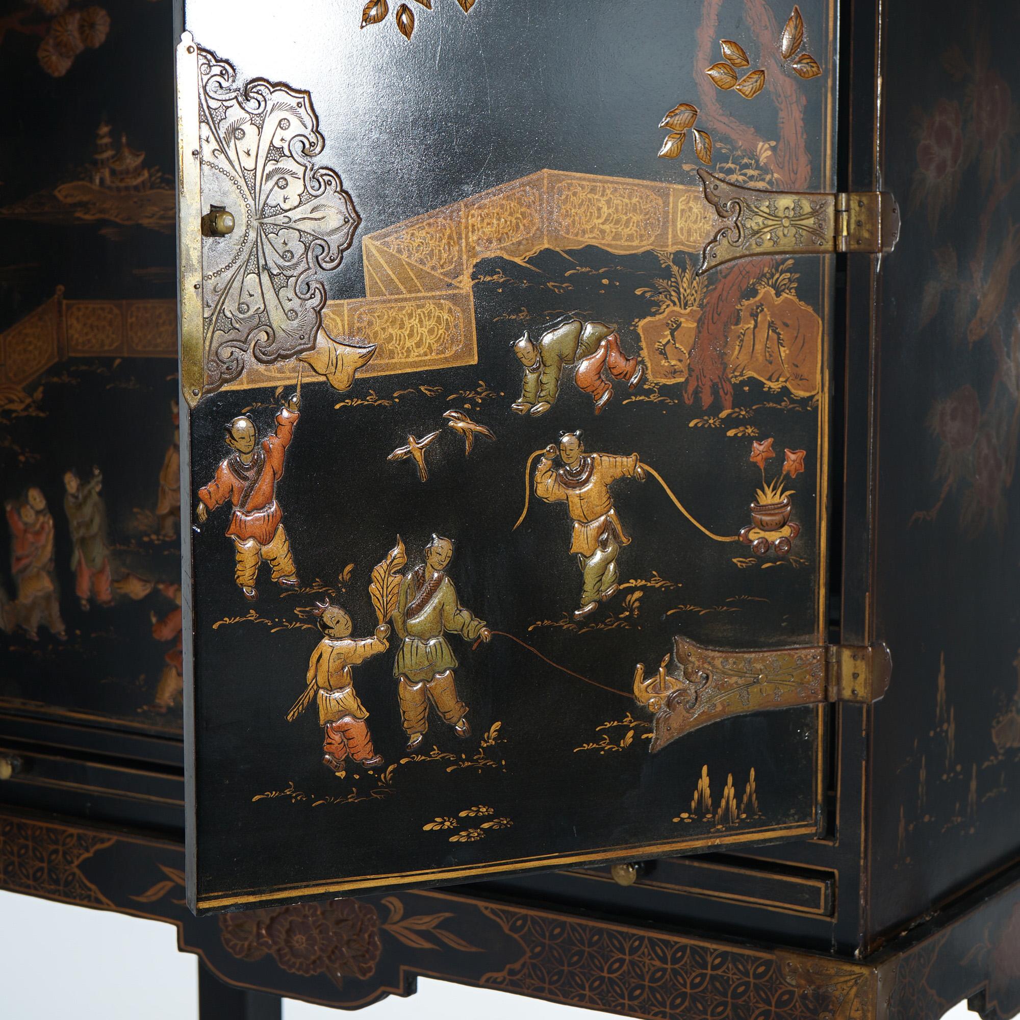 An antique Chinese credenza offers black lacquered wood construction with double doors over matching base; Chinoiserie decorated with figures; 19th century

Measures- 63.5''H x 37.25''W x 16.5''D
