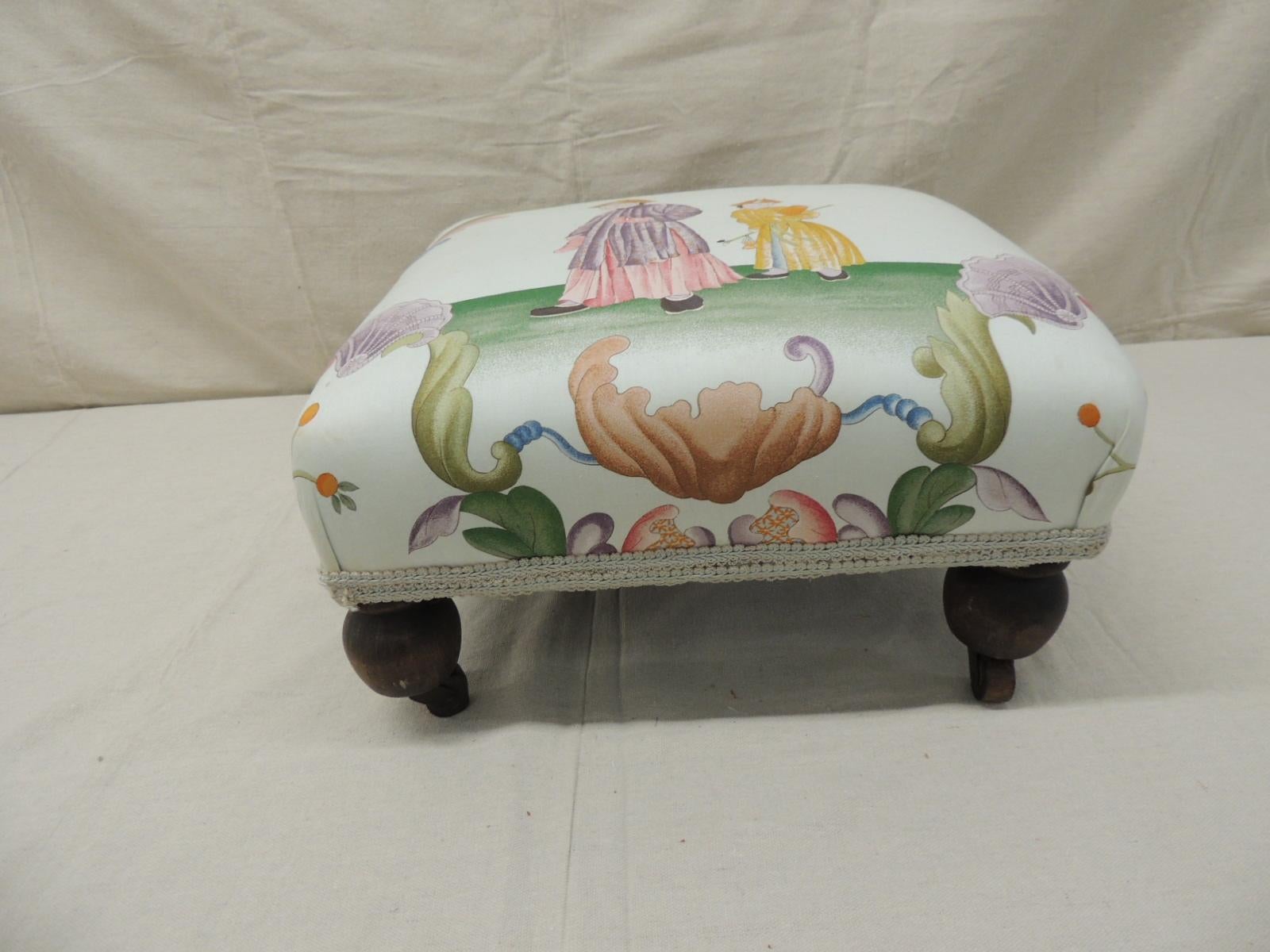 Antique Chinoiserie printed textile square ottoman rounded
Wooden legs and wooden wheels. Gimp trim all around.
Size: 15.5