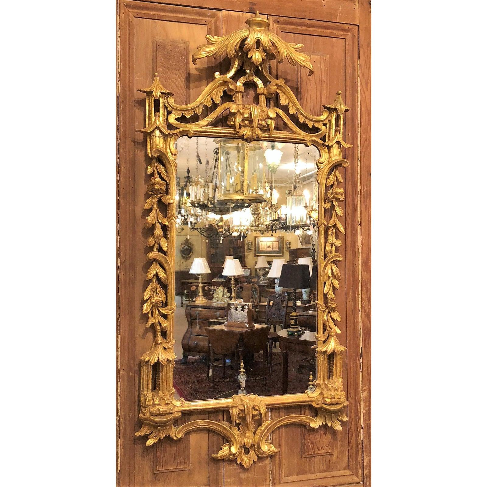 Antique chinoiserie style gilded carved wood mirror, circa 1920-1930.
  