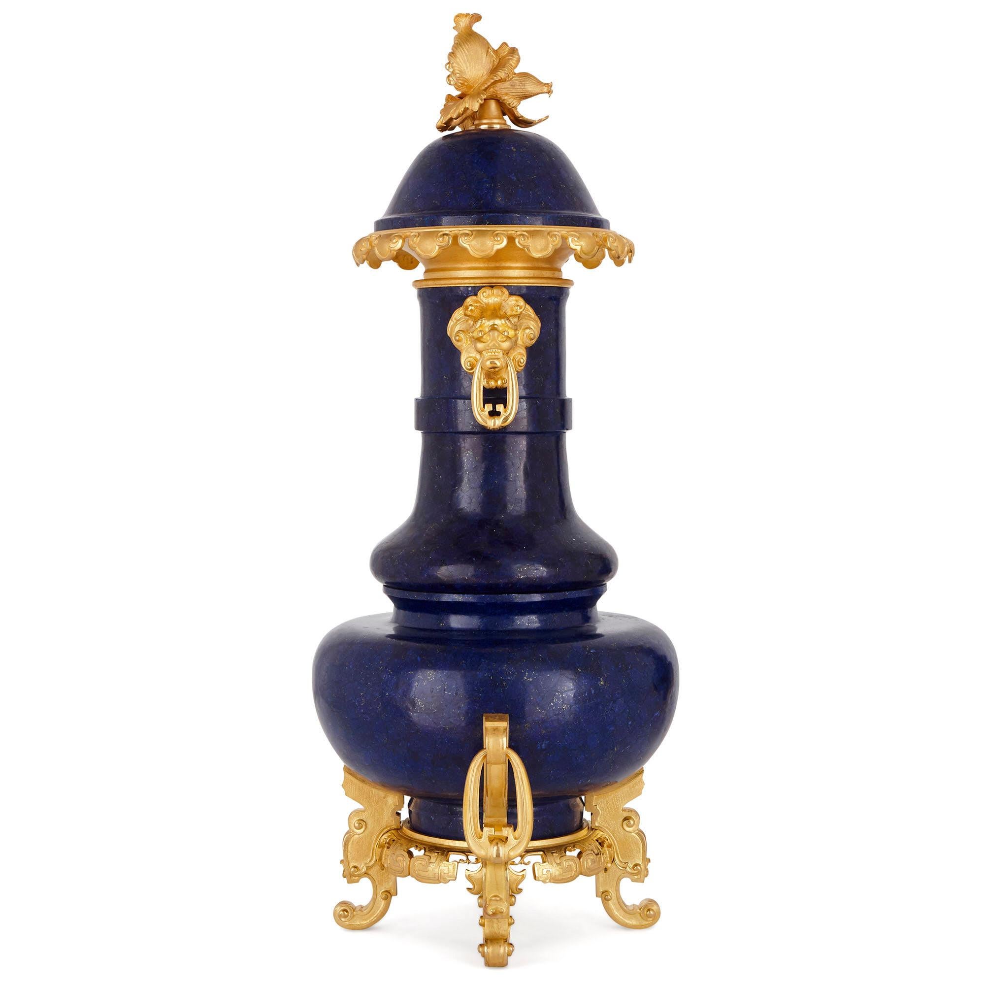 This urn (or vase) has been crafted from the finest materials: the deep blue gemstone, lapis lazuli, and lustrous gilt bronze (ormolu). The urn is designed in a style known as ‘chinoiserie’, a French style that is inspired by Chinese decorative