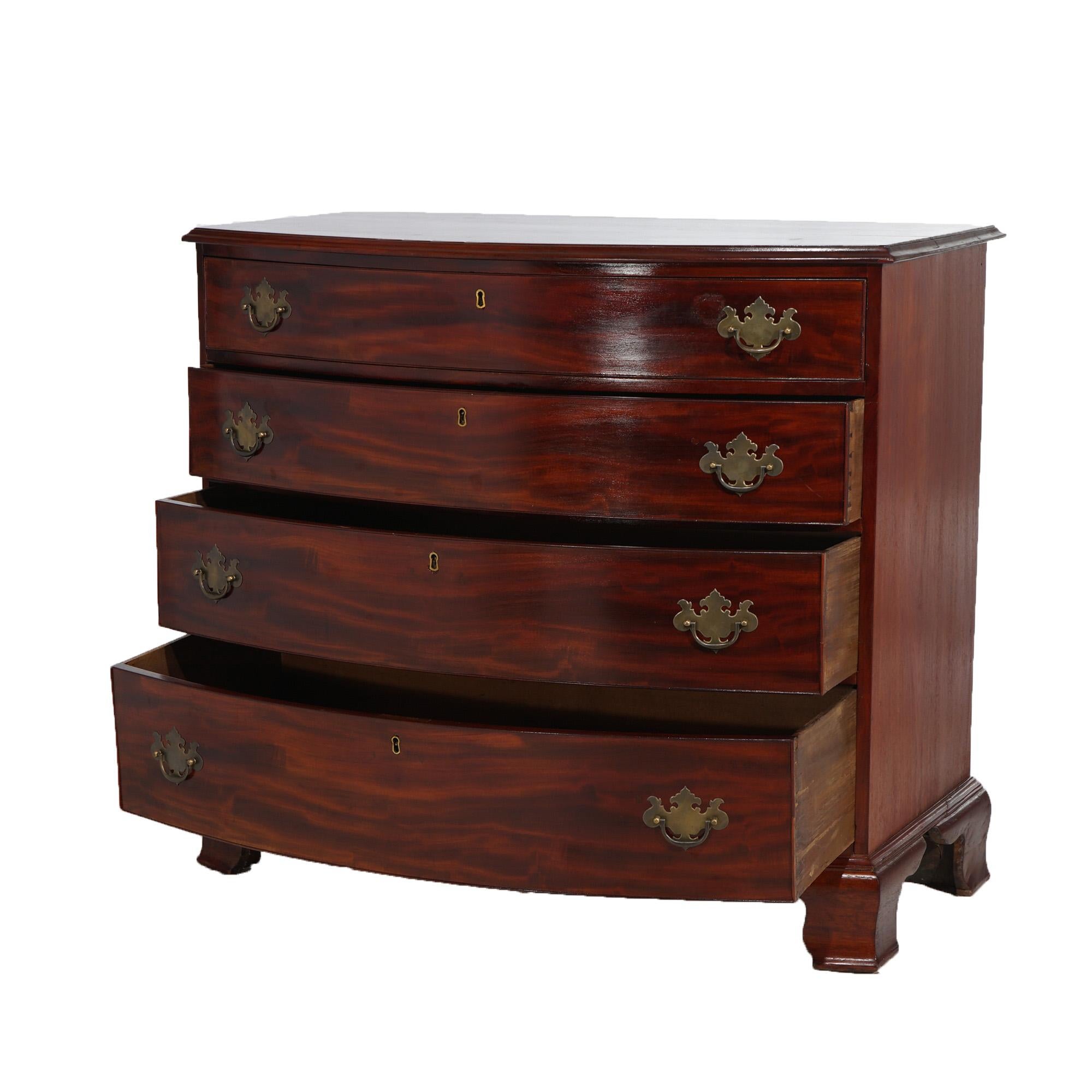 An antique Chippendale chest offers flame mahogany construction in bow front form and having four graduated long drawers, raised on bracket feet, c1830

Measures- 37.25''H x 41.75''W x 23.25''D